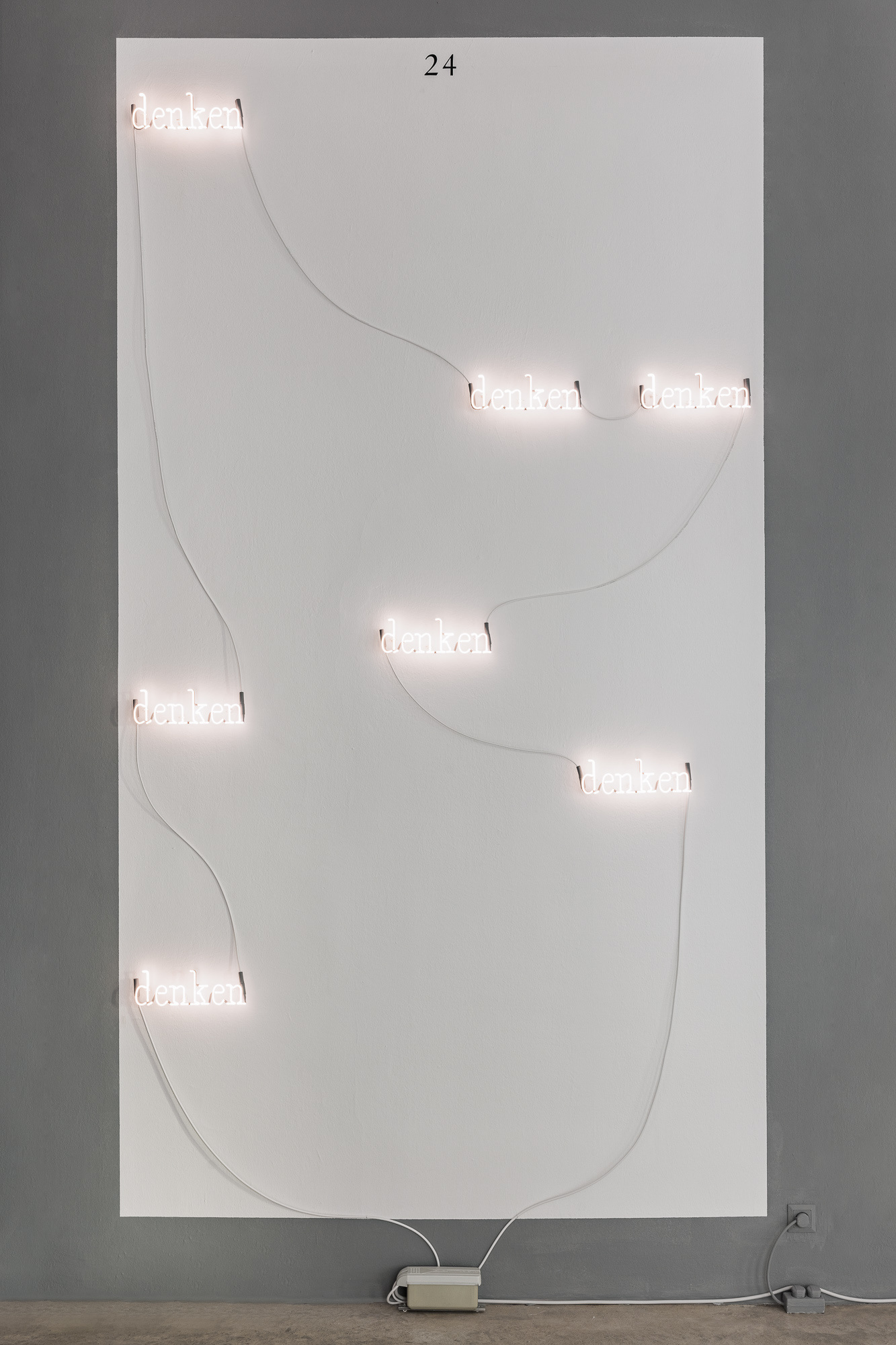 JOSEPH KOSUTH ‘Korrektur (Uncorrected) #1’, 2023 Installation (7 parts) Text reads: denken Warm white neon mounted directly on the wall Dimensions variable © Joseph Kosuth / ARS, New York. Courtesy Christine König Galerie, Vienna.