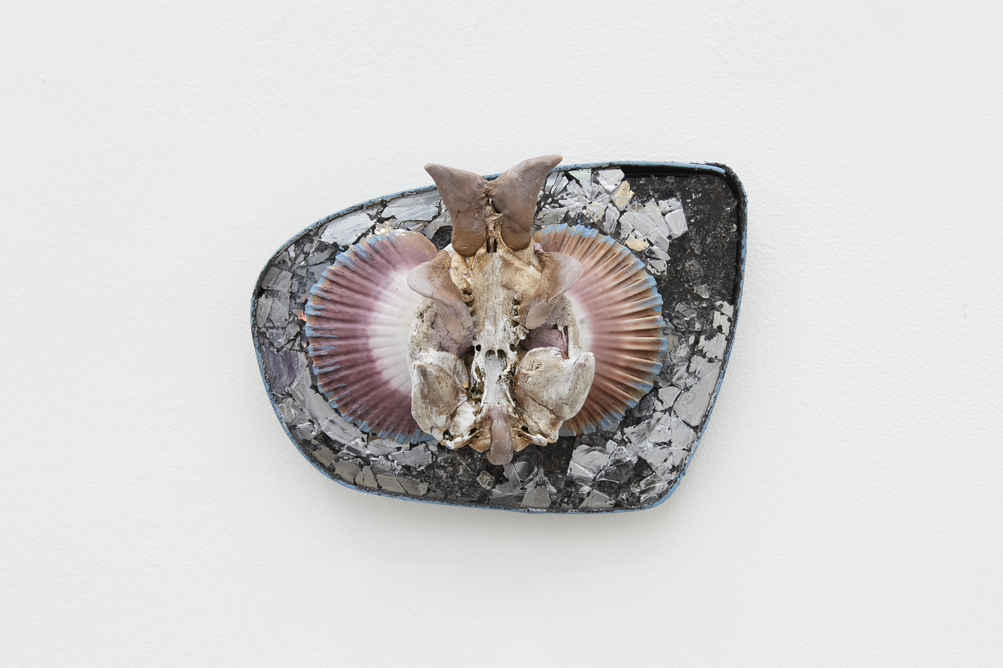 Tristan Higginbotham, Crab Variation (Dhalgren), 2023. Found mirror, scallop shells, muskrat skull, resin clay, flashe, acrylic, 14 (H) x 19 (W) x 7 (D) cm