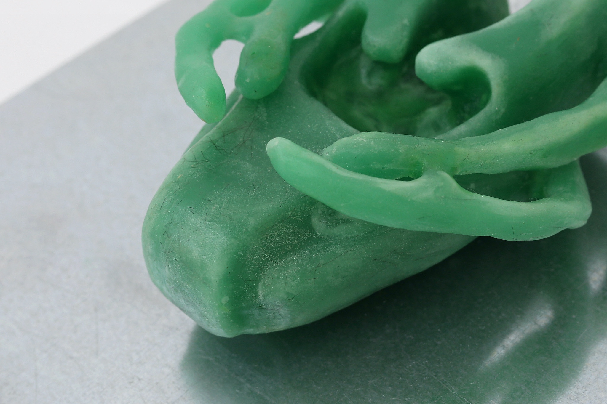 Therese Bülow, "Hull (Connect)", 2023. Wax, steel shelf, 24.0 x 28.0 x 4.0 cm