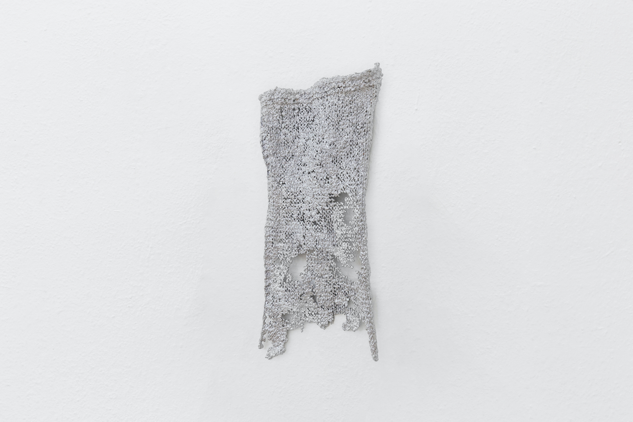 Therese Bülow, "Fragment of Double Layered Sweater. Type: Knitting", 2020. Aluminium, tent pegs, 35.0 x 20.0 x 2.0 cm