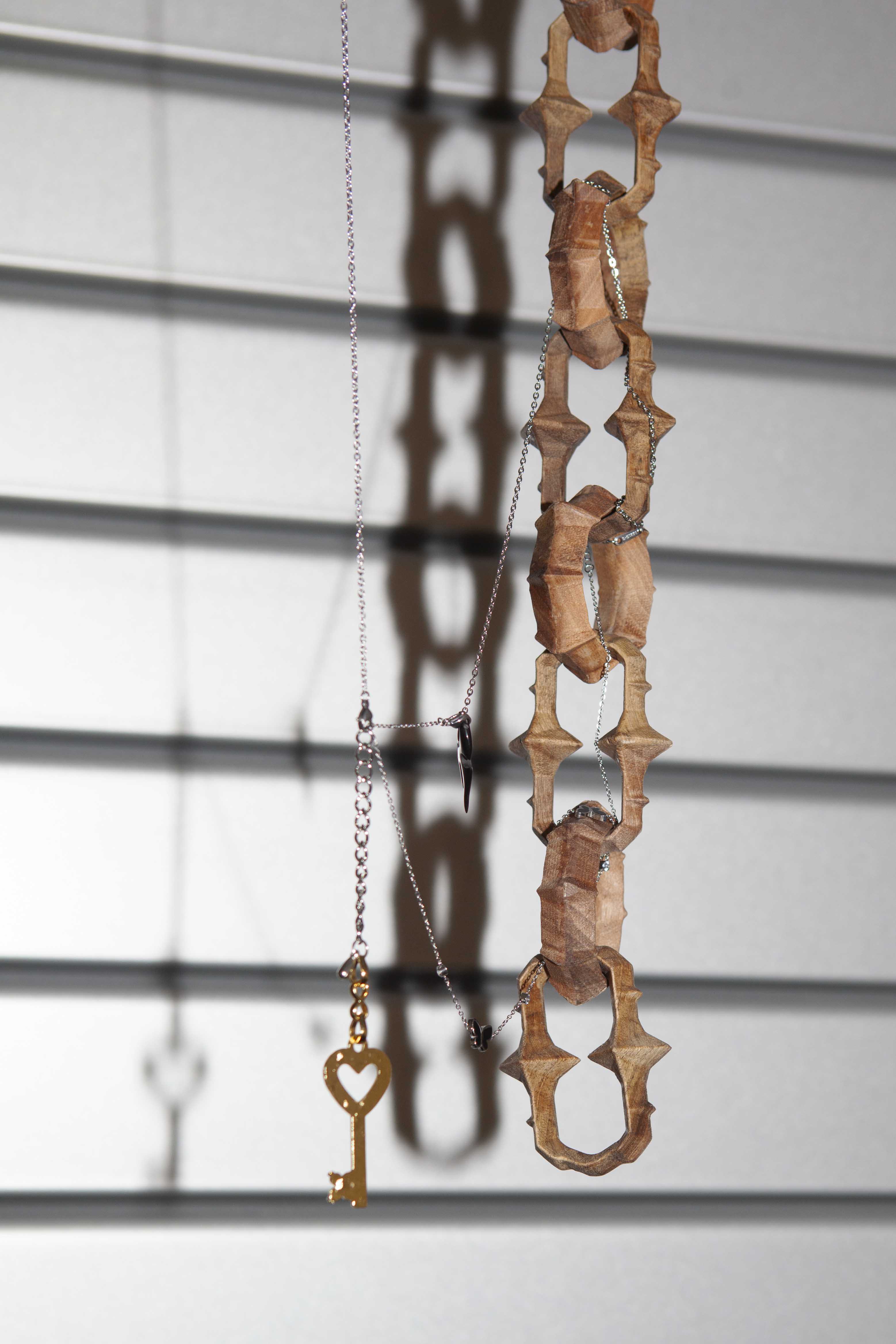 Detail of Emma Pidre "Untitled (office ceiling chain)" 2023