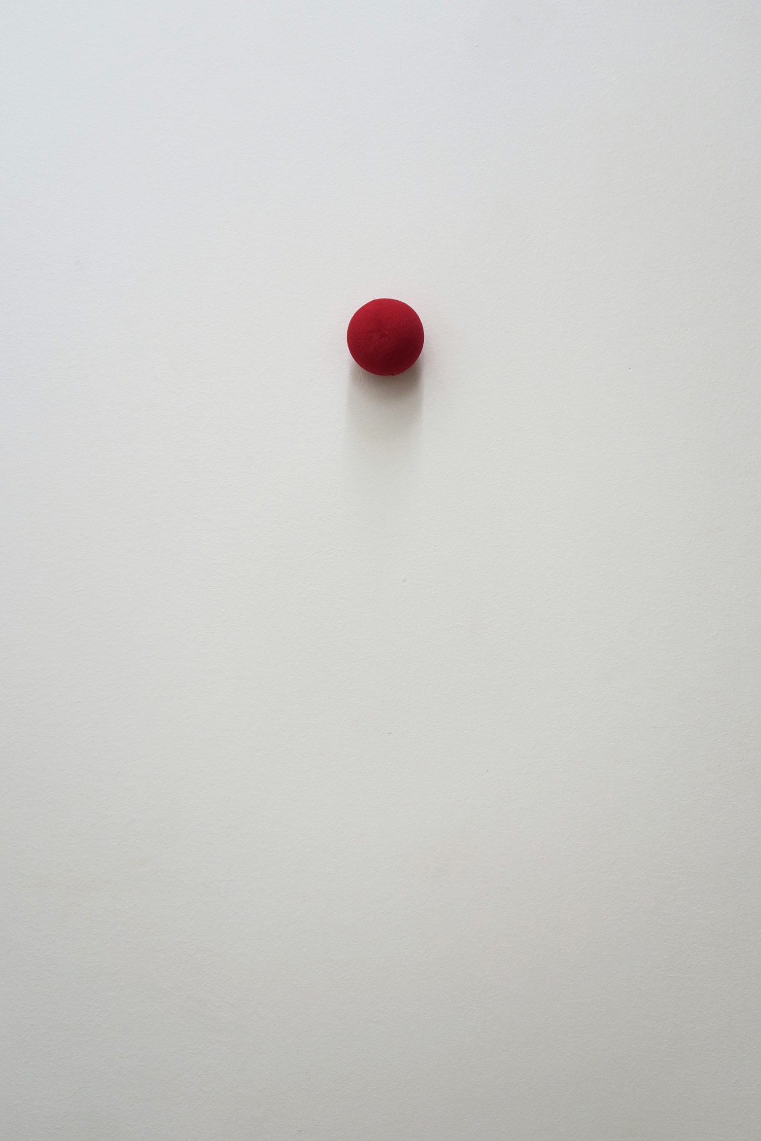 Clémentine Adou, Red nose, red dot, 2023, red nose, motor, 5 × 5 × 5 cm