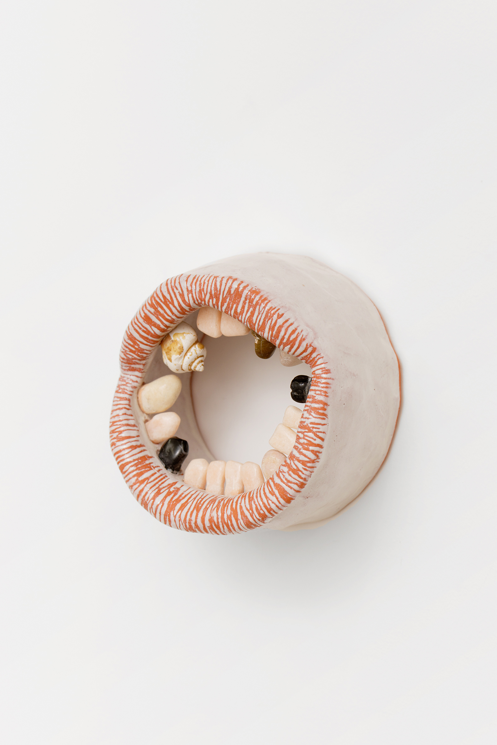 Lou Masduraud, Kiss (without health insurance but an anti-speciesist approach of the mouth as an environment), 2023, glazed ceramic, pink marble, black marble, rocks, sea shells and sea-polished glass, 12 x 12 x 7 cm, unique