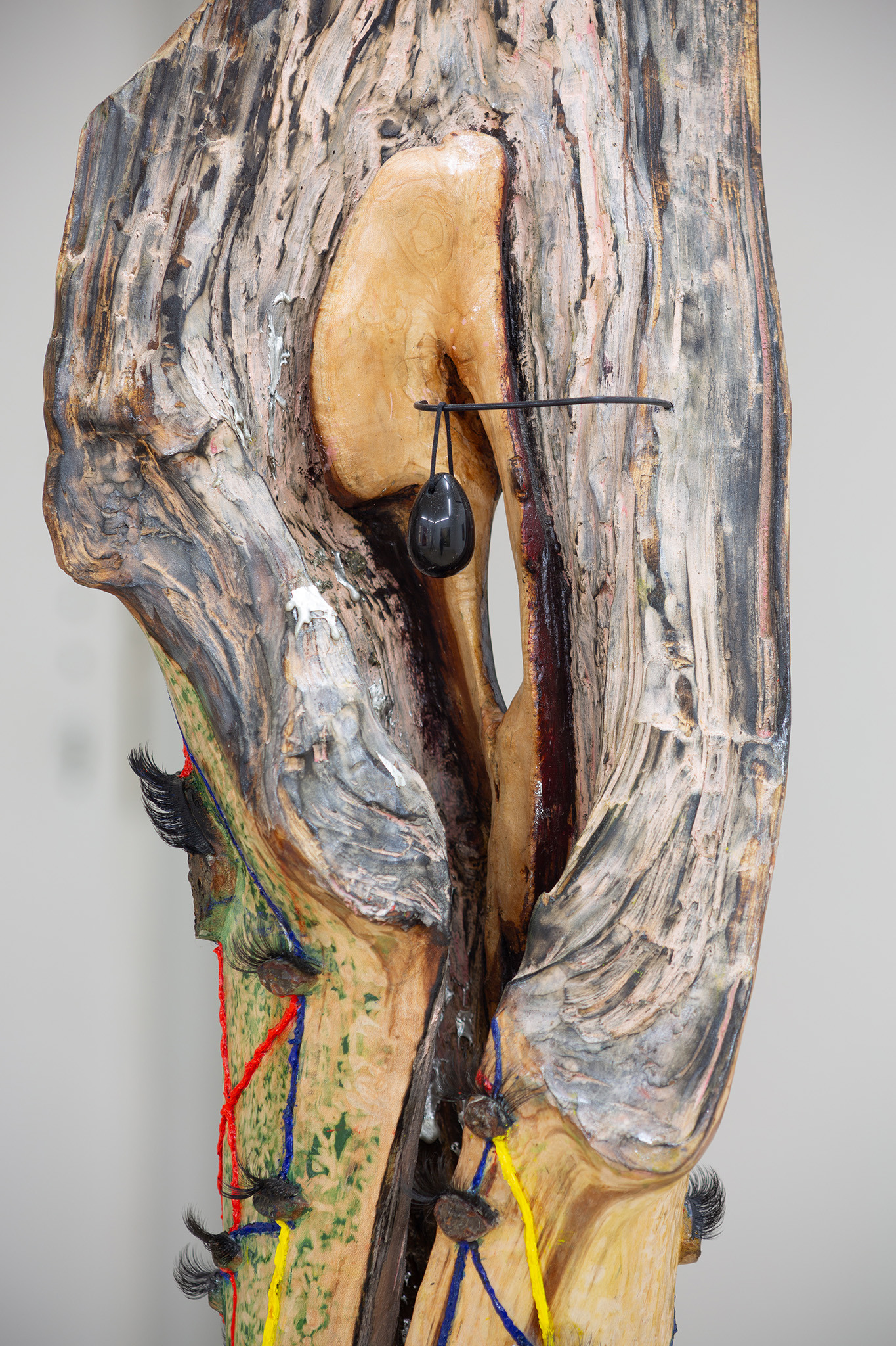 Milda Lembertaitė, Leela Game, 2021. Found wood (Hilly Fields, London), Obsidian, Oil Paint, Pewter, Synthetic Eyelashes, 186 x 94 x 46 cm