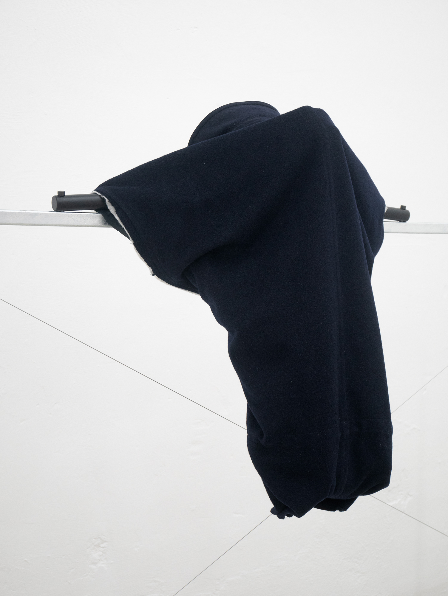 Clemens Tschurtschenthaler; socially detached figure; detail; 2023; galvanized steel, loden coat, plastic wraps, water; 129 x 170 x 69 cm