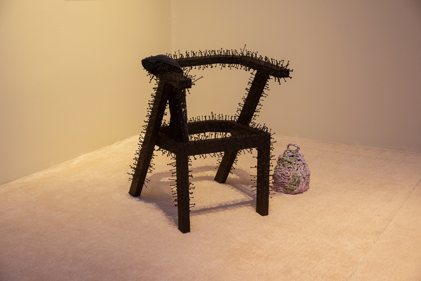 La fonderie Horne nous tue lentement, 2023, wood, repurposed screws and nails, paint, 80 x 61 x 56 cm