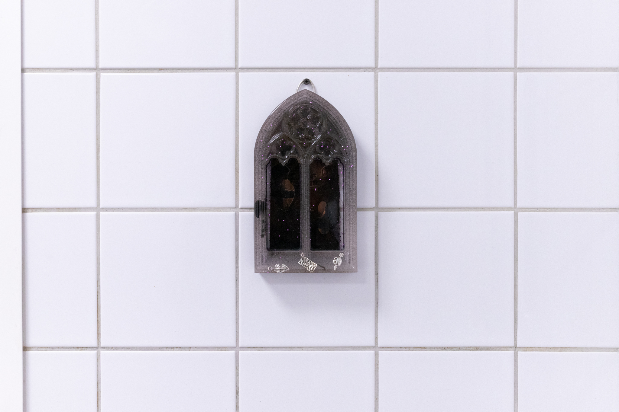 Pitted Dates: DOWNWELLING STARLIGHT, Shia Conlon: Anthems for a Seventeen Year Old Girl, 2022, Resin, ink, Xerox images & poems, charms, 15x12x4,5cm