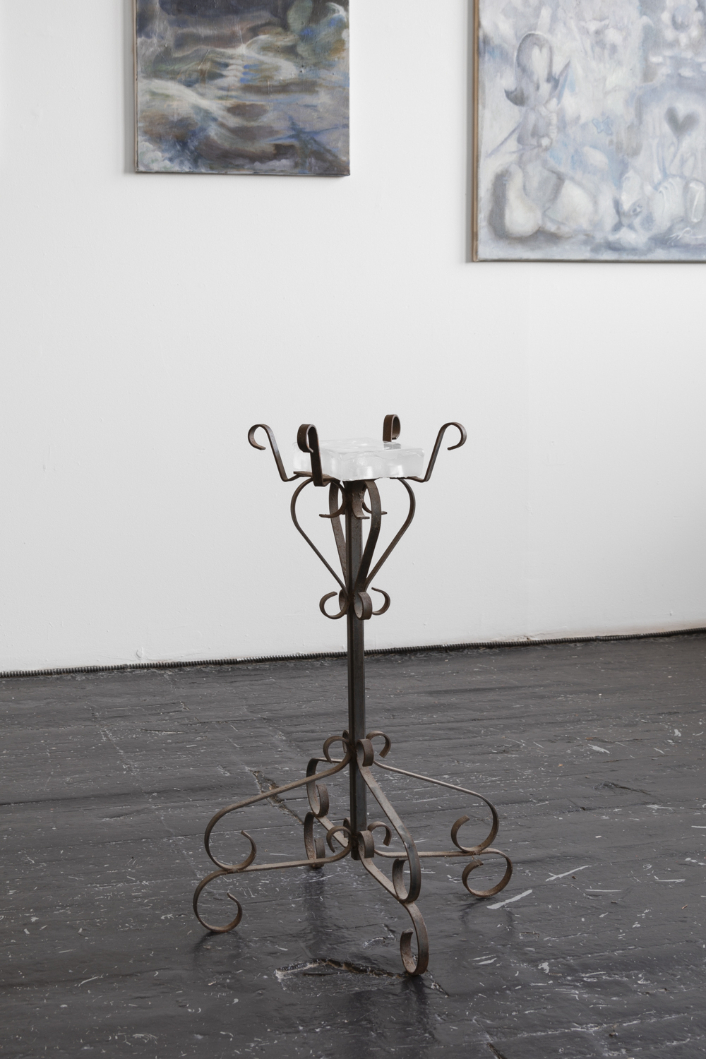 Adrienne Greenblatt, Tzimtzum (The Sacred Void) ( 2023) Cast Glass on antique iron stand