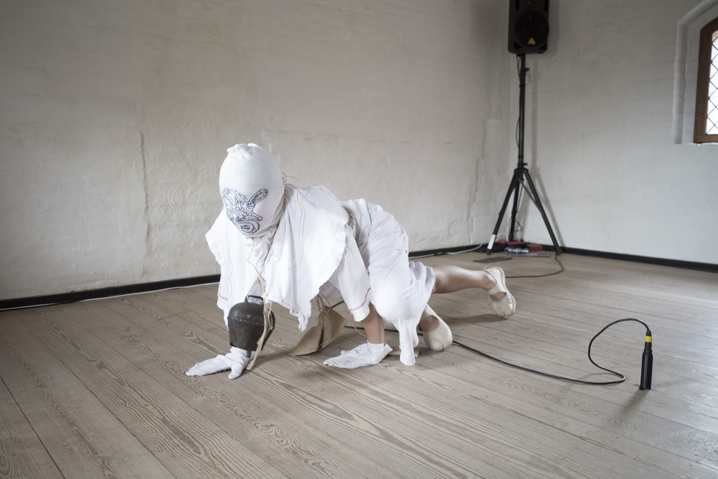 Anders Aarvik, Ayshan Qvortrup, Aske Hvitved, 0, performance (co-choreographed and performed by Ayshan Qvortrup), teasels, steel pipes, brick remains, sewn patient clothes, gauze bandage, wooden figurines (by Aske Hvitved), Variable dimensions