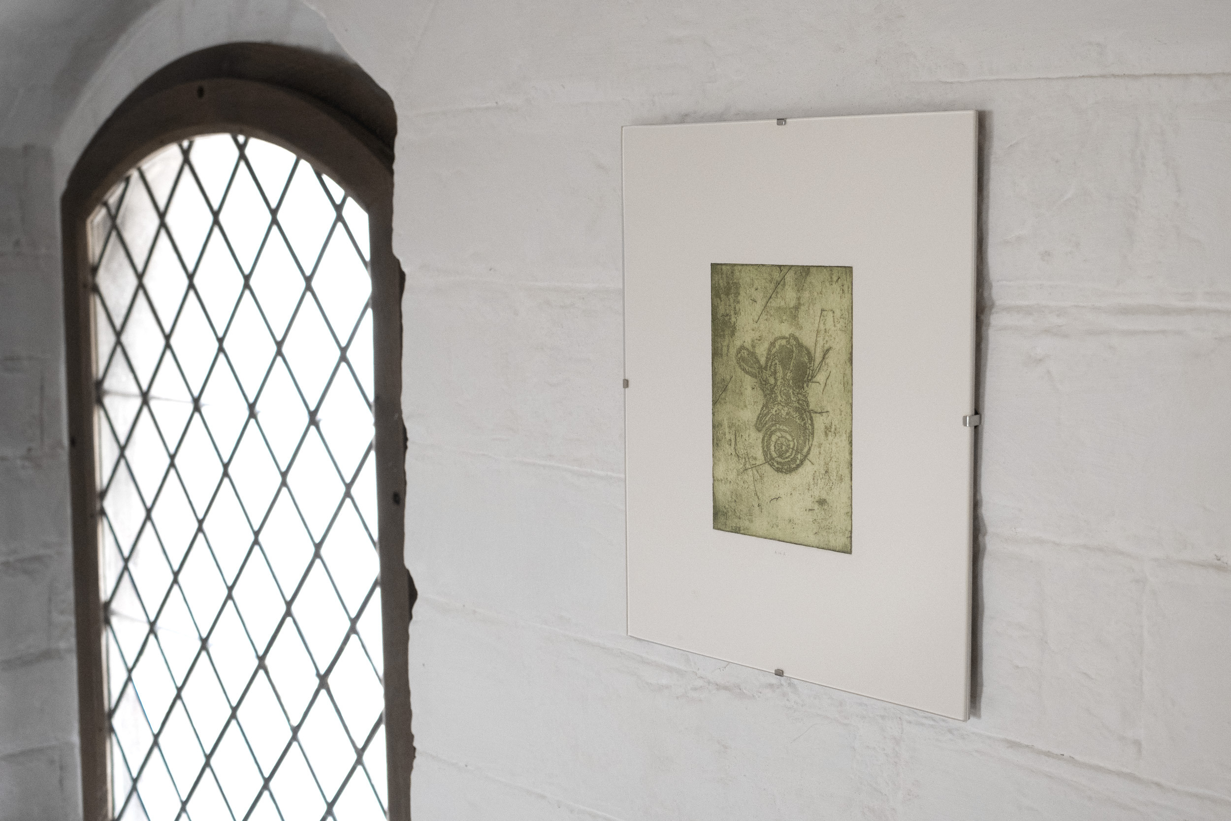 Anders Aarvik, untitled (inner ear machine fossil sigil), Etching, water-based ink and soil, cotton paper retrieved from deceased artist, plotting with GraphGear 1000, found clip frame, 3x 24x30 cm each