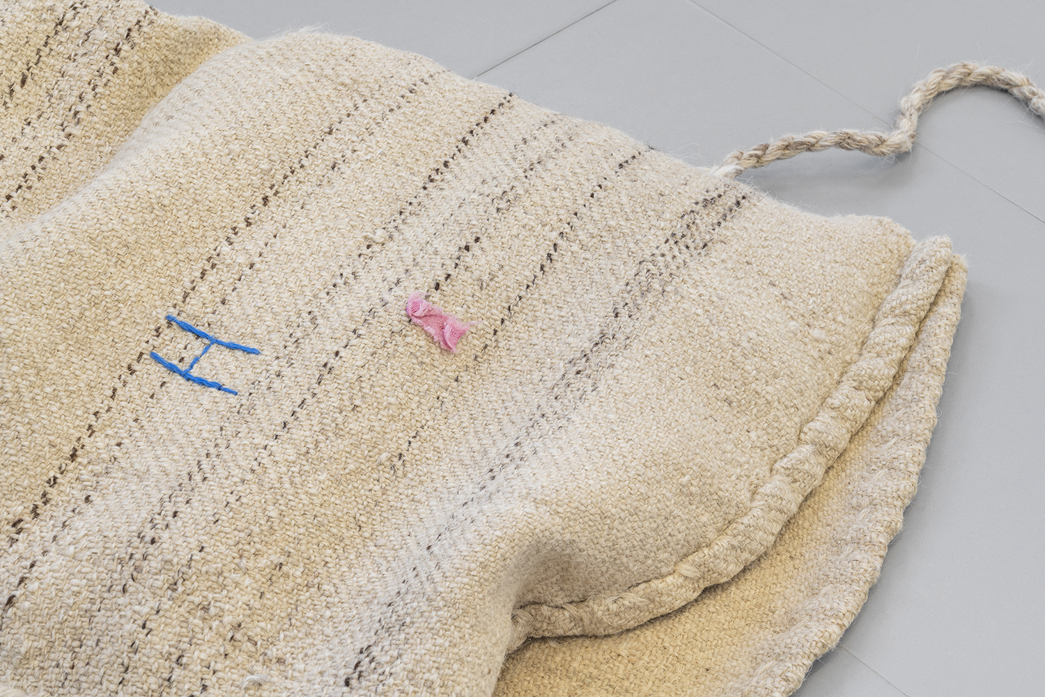 Exhibition View «UNSEEN RECONSTRUCTIONS; view on Vladimir Miljević, Carbon Copy Series, bricks covered with beeswax with words and phrases, 2023» at La rada / Photo: Riccardo Giancola / Courtesy: the artists and La rada