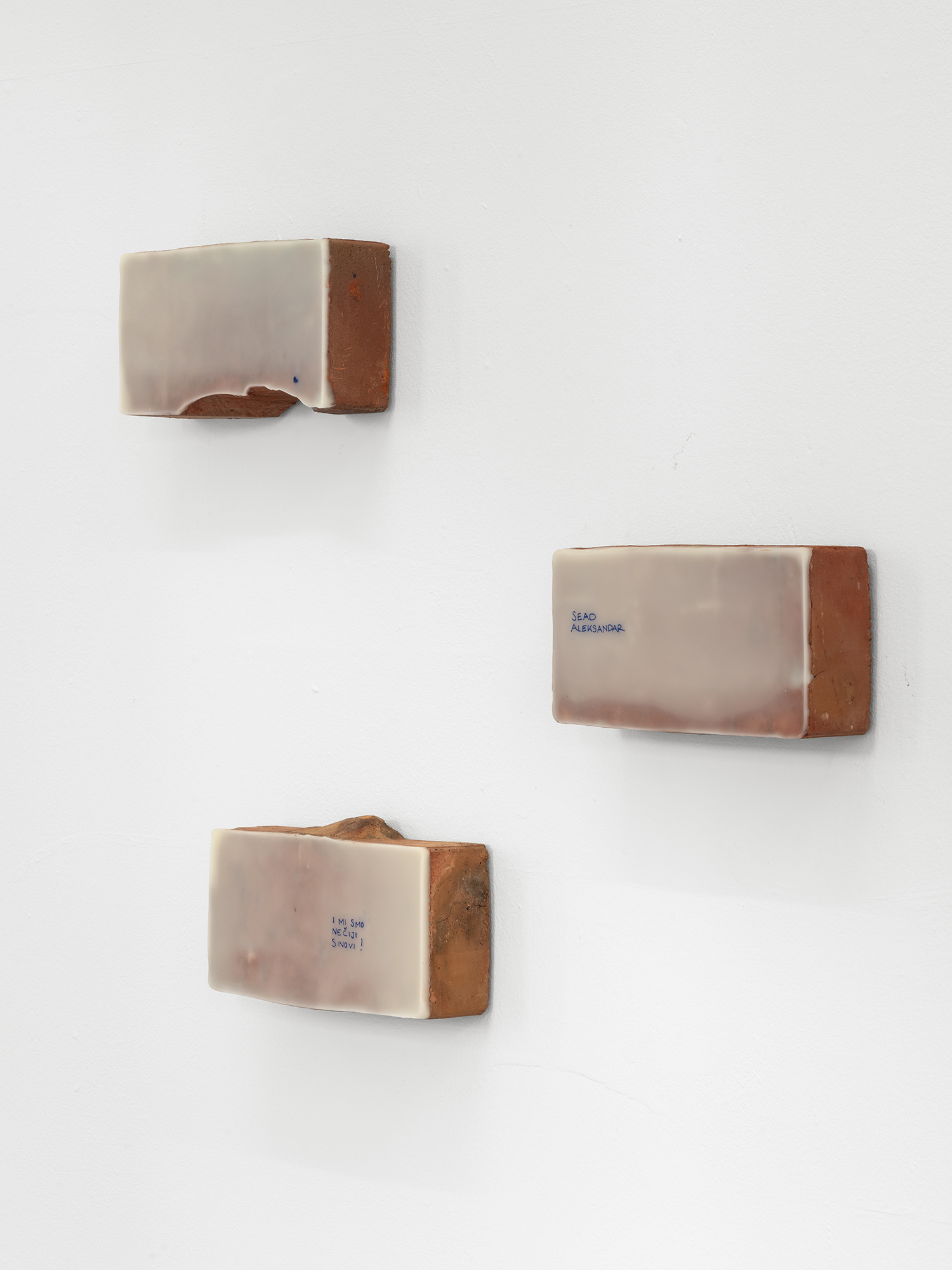 Exhibition View «UNSEEN RECONSTRUCTIONS; view on Vladimir Miljević, Carbon Copy Series, bricks covered with beeswax with words and phrases, 2023» at La rada / Photo: Riccardo Giancola / Courtesy: the artists and La rada