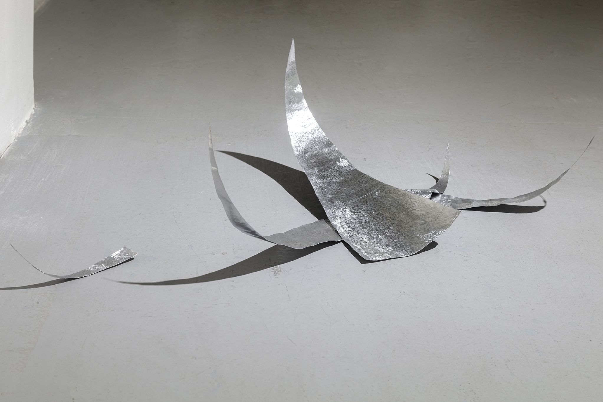 Untitled (I would like to know why), white felt, hand-hammered aluminium, 2023