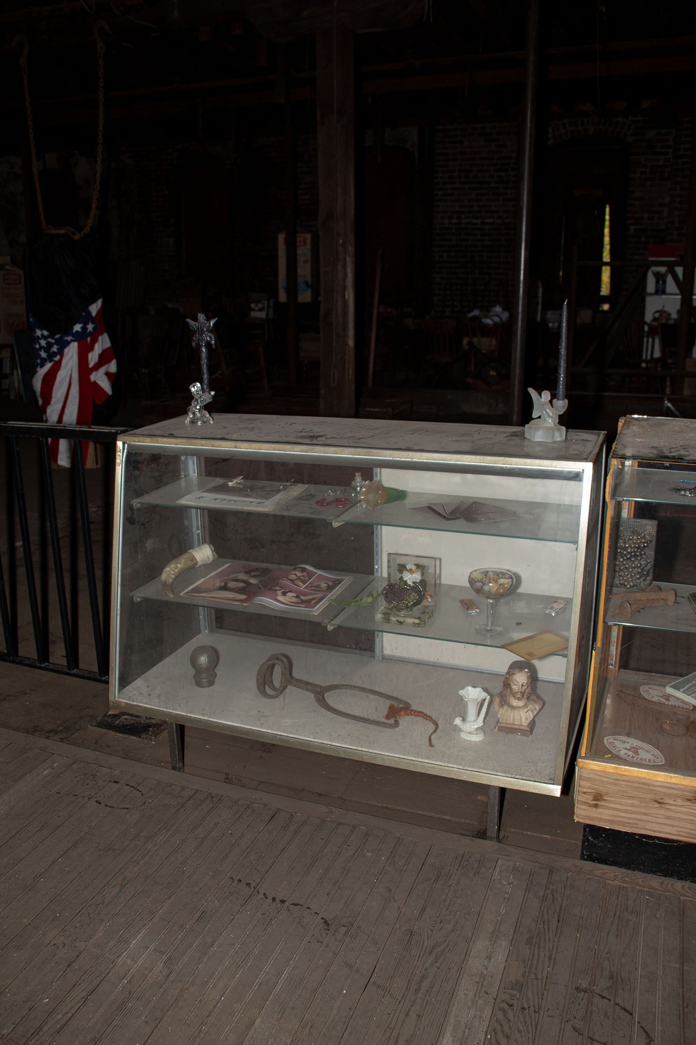 Installation View Cléo Sjölander & Alex Patrick Dyck, Cabinet of curiosities, 2023 Found objects, resin, Youngstown nails, vintage erotic magazine, horn, glass display case, 56 x 36 16 in