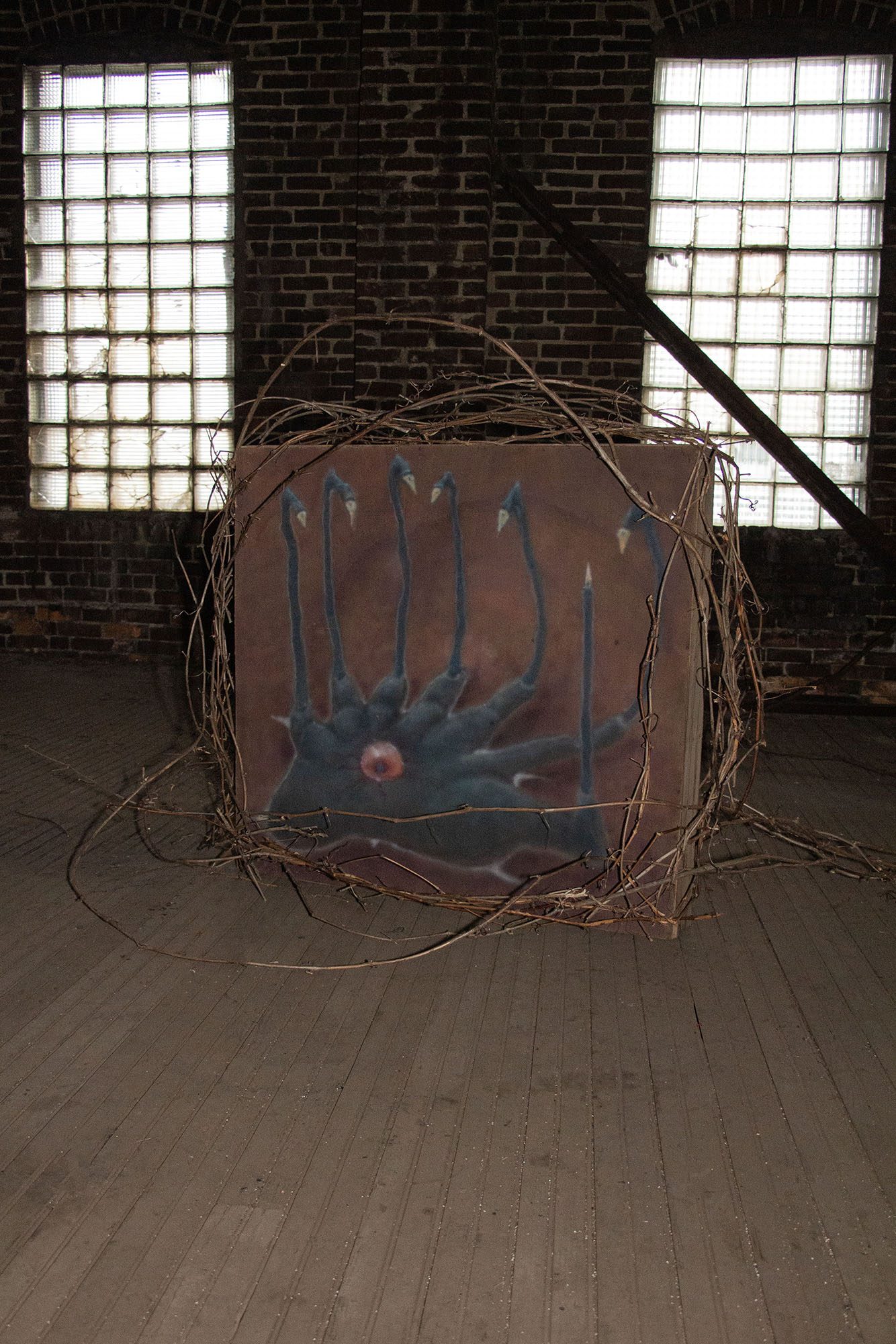Julien Parant Marquis and Alex Patrick Dyck, Necrid’s Grip, 2023 Acrylic on masonite board, wood, vines,  (Inside) resin, found objects, Youngstown nails, glass, hickory nuts, 35x37x6 in