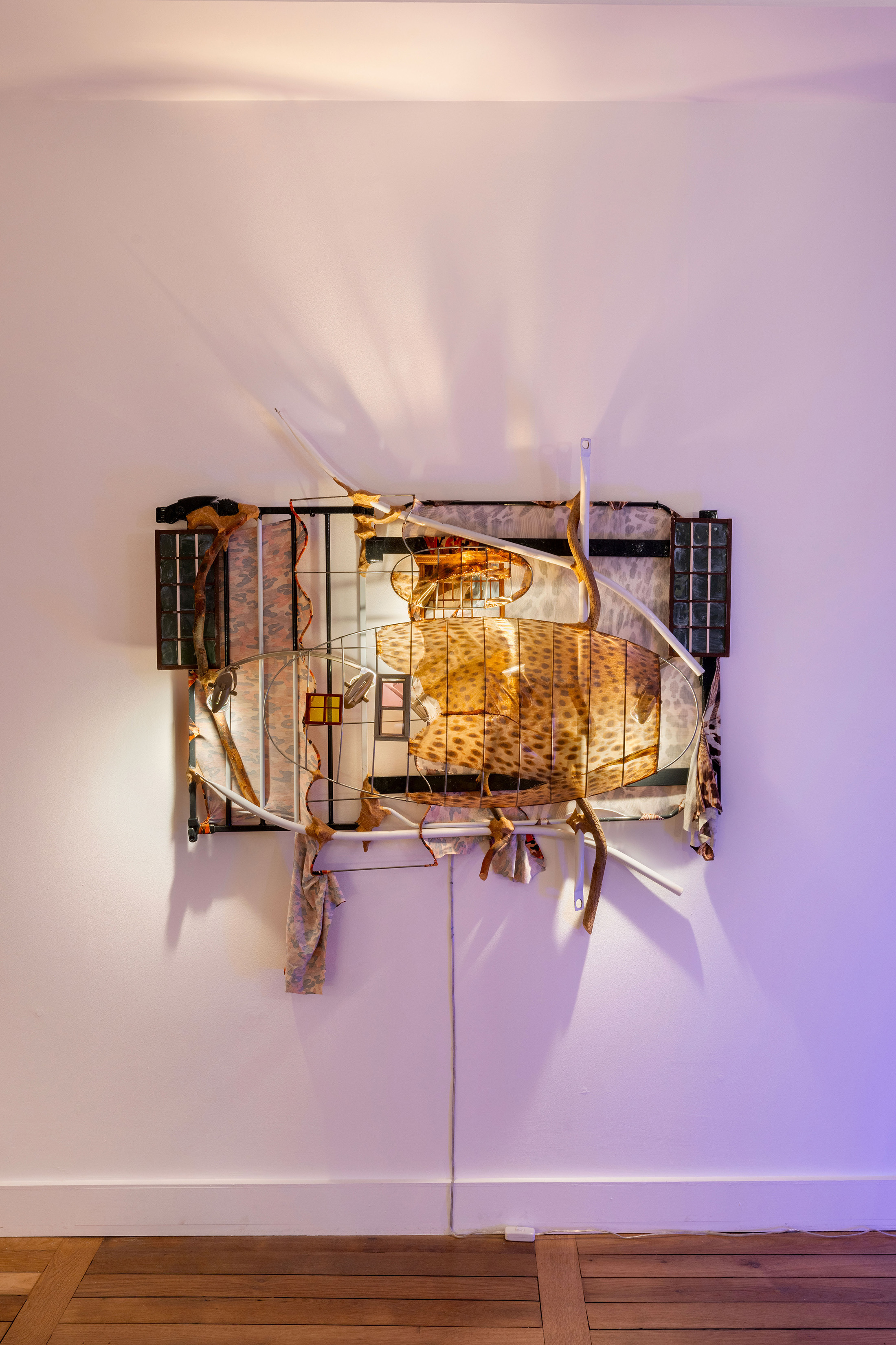 Jessi Reaves, *All hope for a better past*, 2023, Metal, wood, fabric, paint, sawdust & wood glue, lamp wiring, 104, 14 × 147,32 × 30,48 cm