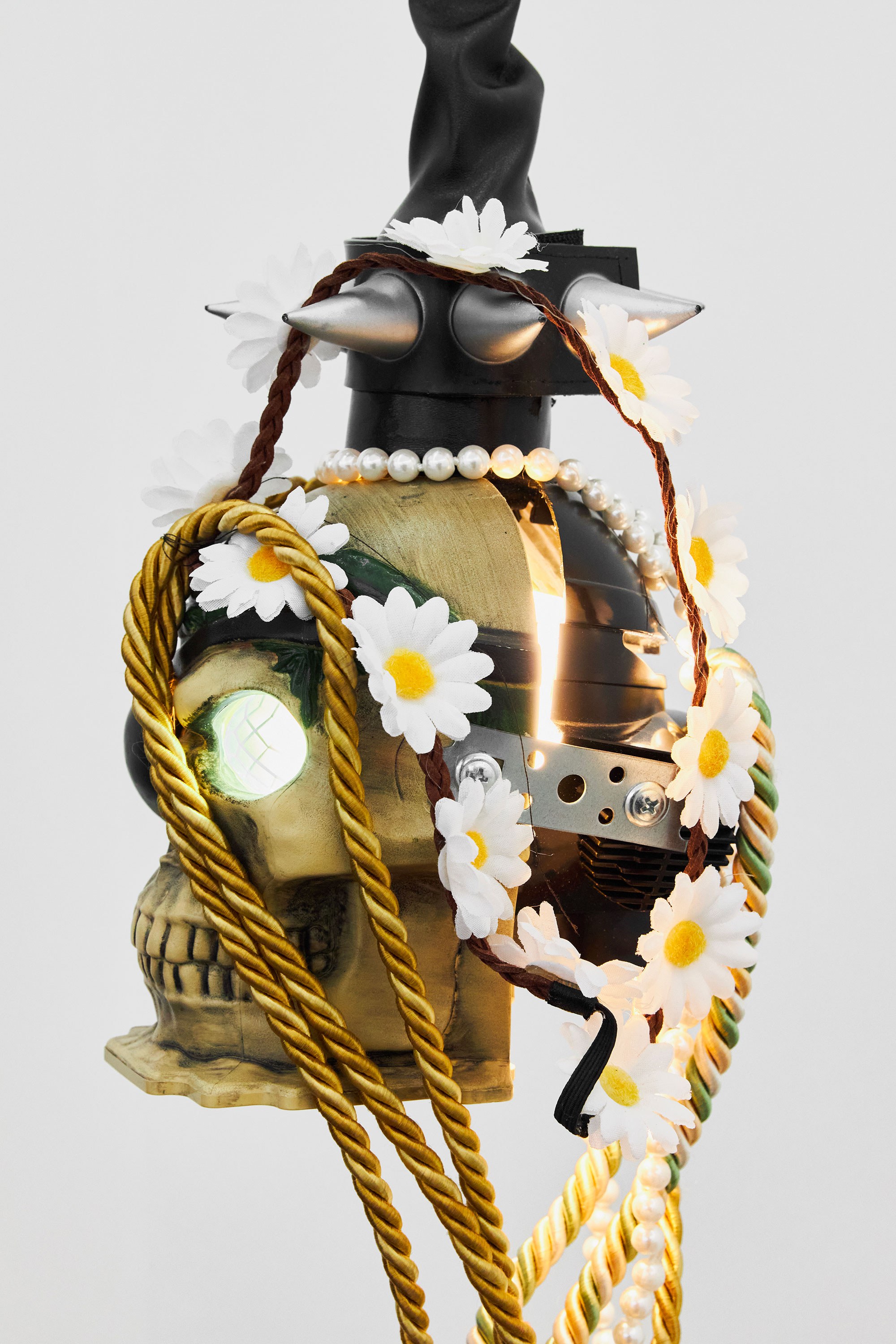 Renaud Jerez, *Untitled (Miroir noir - Poisson/Dragon)*, 2018, Light bulb, masks (skull & Darth Vader), accessories (plastic flowers, plastic beads, spike bracelet), curtain ropes, leatherette, electrical system, 220 × 20 × 14 cm