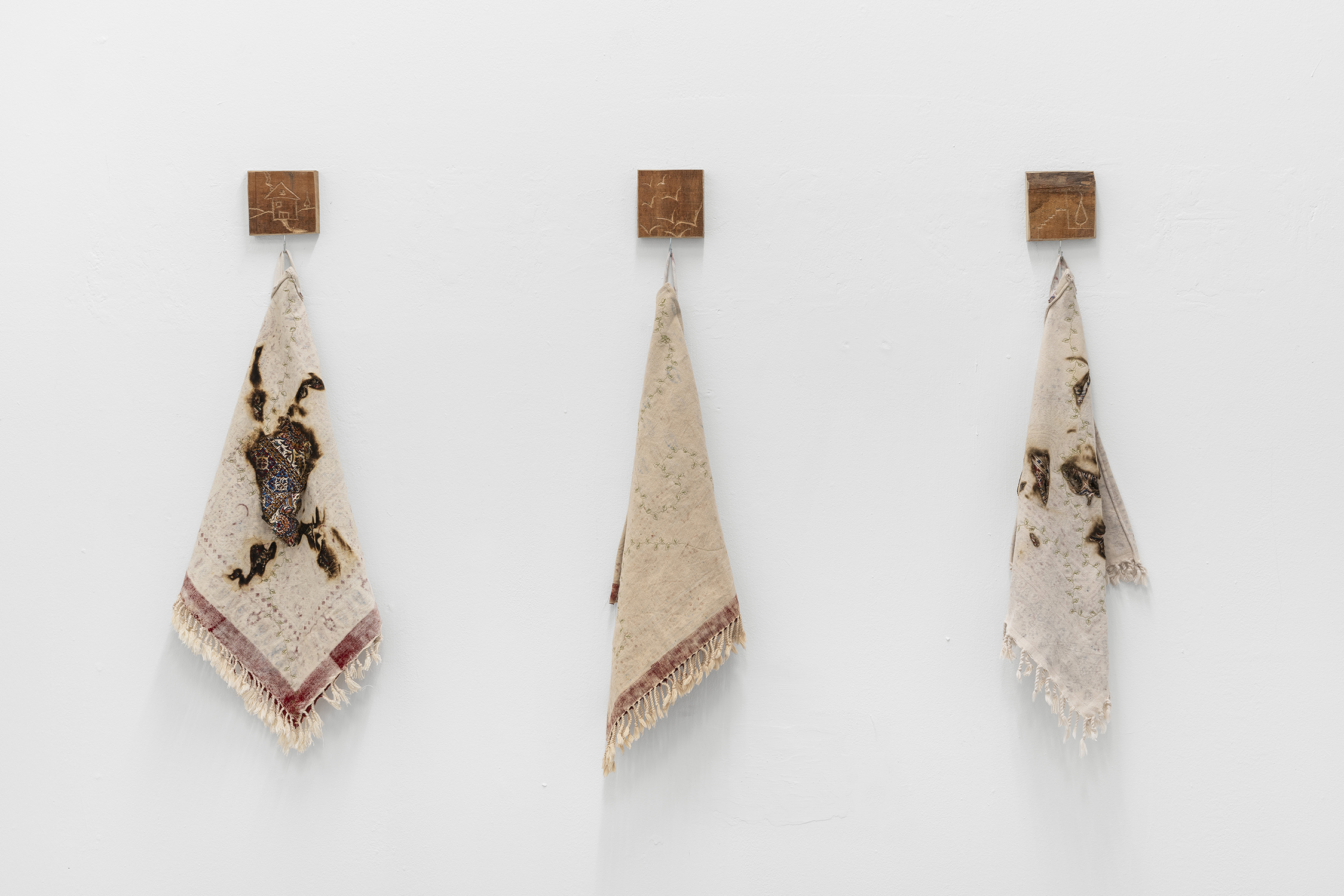Exhibition View Group Show «Gulp; view on Zahrasadat Hakim, I yearn to my mother’s bread, 2023, 10 embroidered cloths, carved wood 50 x 45 cm each» at La Rada, Locarno, 2023 / Photo: Riccardo Giancola / Courtesy: the artist and La Rada