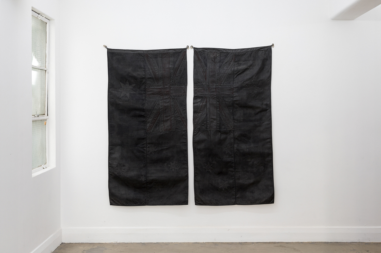 Nick Devlin, Black Flag 2017. Acrylic polymer paint on Australian flag Diptych 90 x 180 cm each