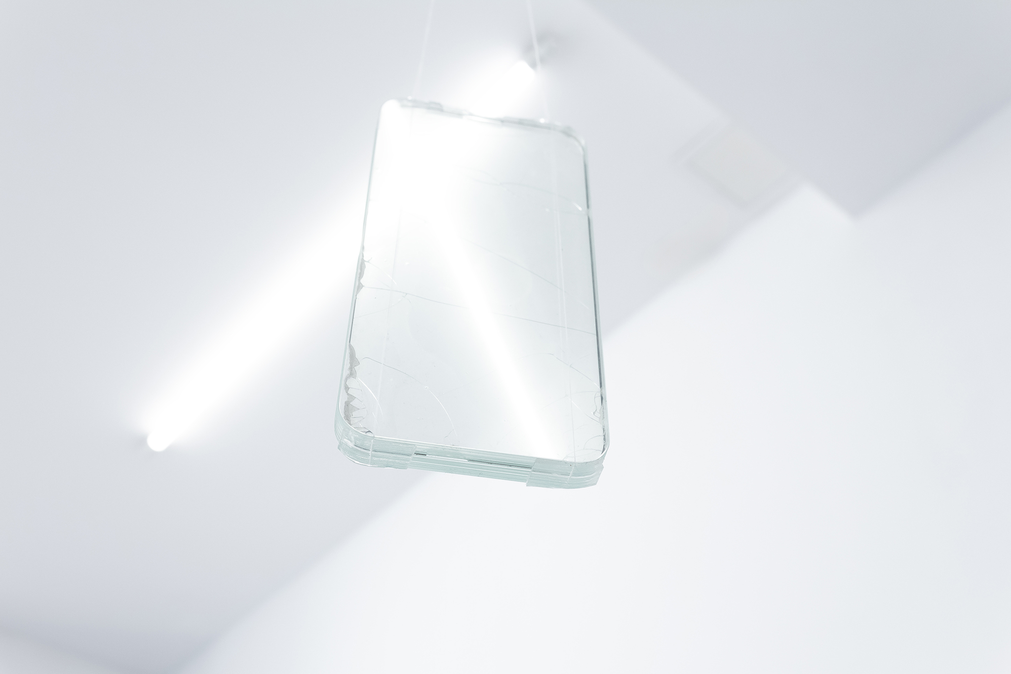 untitled, object: tempered glass, thread, mounting tape, 14.6x7.5x0.76 cm, 2023.