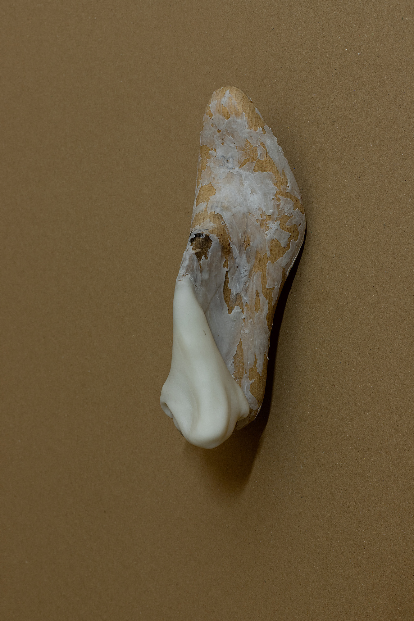 Ian Waelder. Sprain (38), 2023. Antique wooden last and air-dry porcelain. 24 x 11,5 x 8 cm