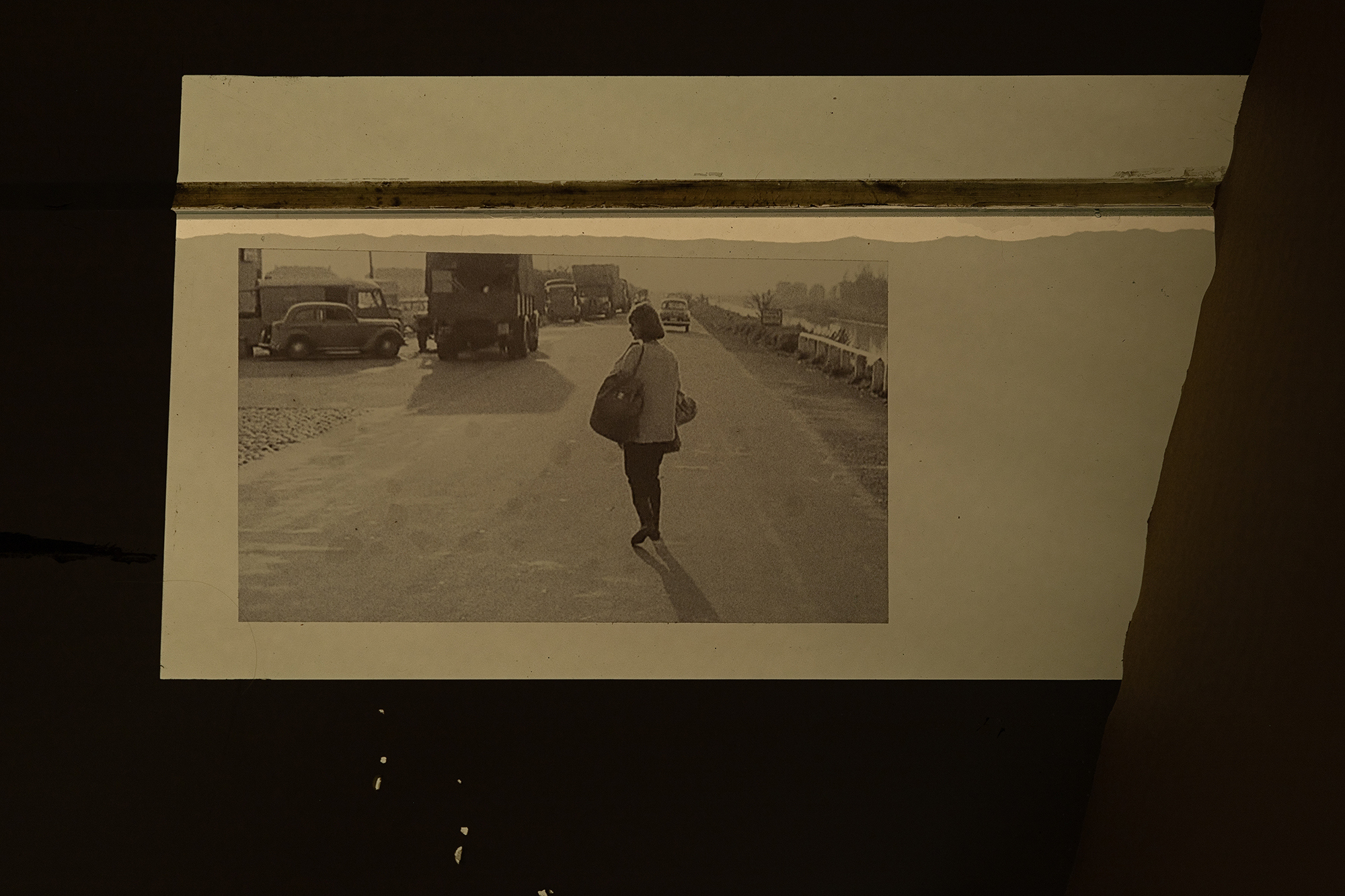 Ian Waelder. Background Vehicle Series, 2021â2023. Floor vinyl prints. Series composed of film stills where the Opel Olympia car from 1935 appears in the background of the scene of a number of different movies.