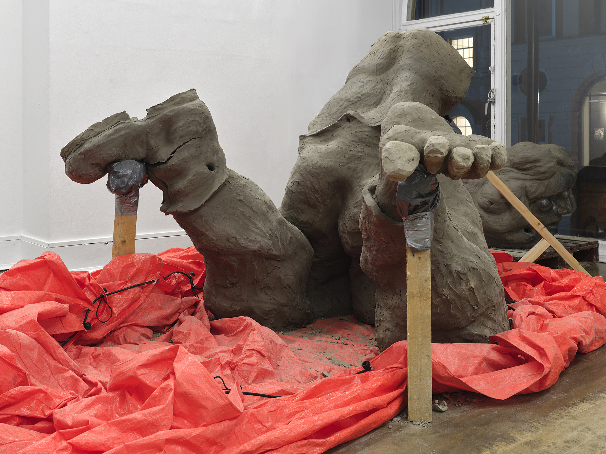 Benjamin Orlow, Ritual City, 2024 Clay, graphite, wood, tarp Dimensions variable
