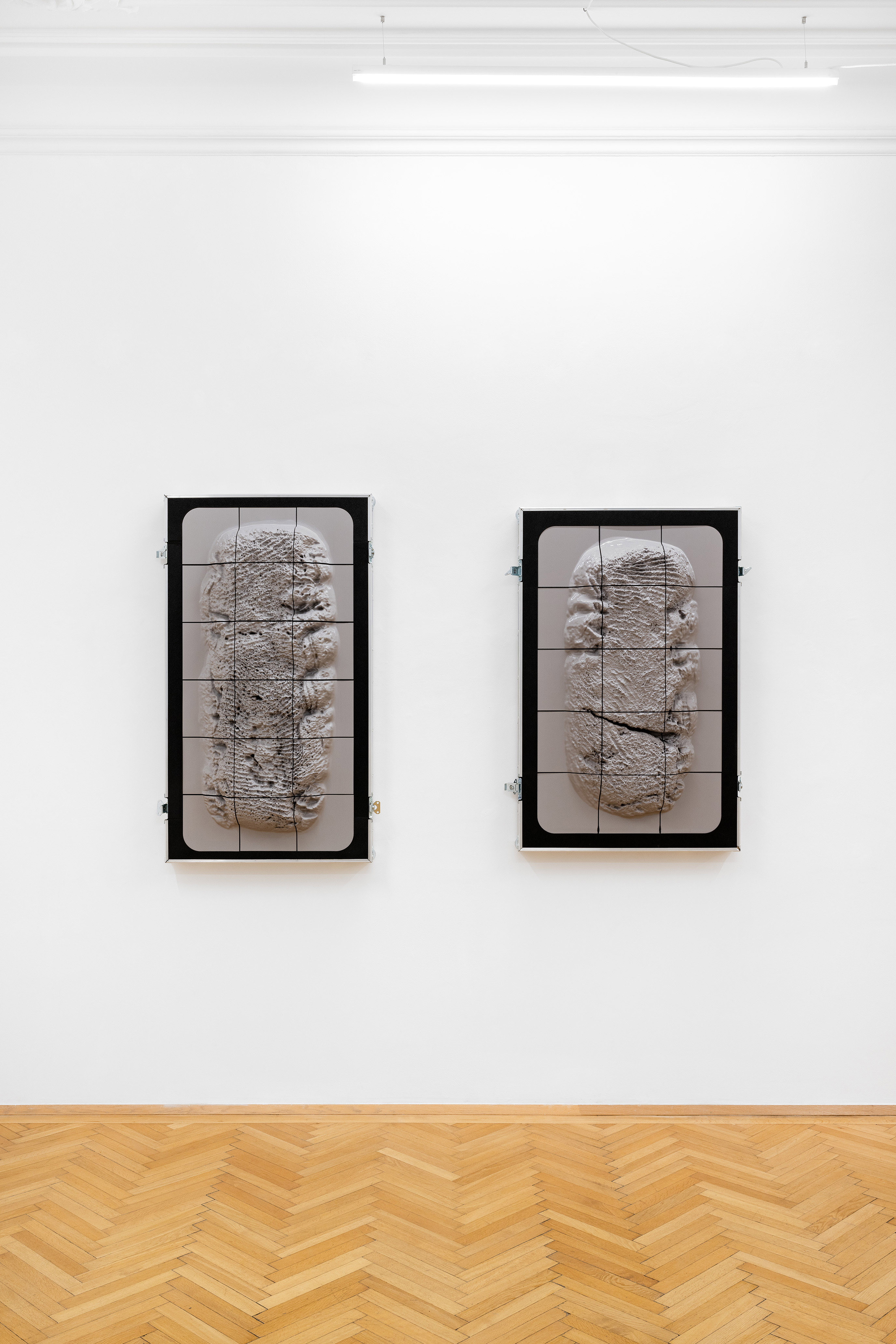 Sami Mandee: Untitled (Belly), 2023, PETG print of a heightmap of a delivery note, screen printing plate, aluminum, PE foam (both), 128 x 68 x 50 cm; Sami Mandee: Untitled (Crack), 2023, 116 x 72.5 x 50 cm