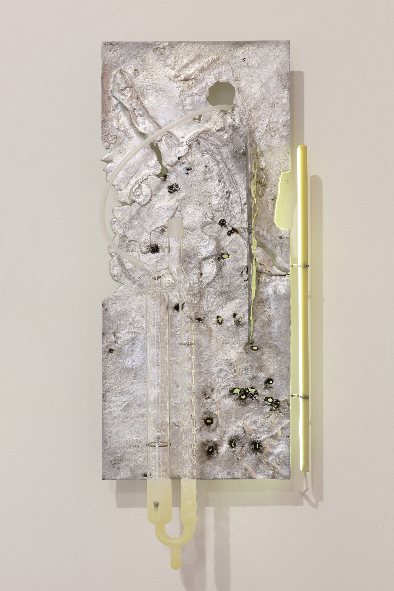 Pakui Hardware, Heat Treated, 2024. Casted aluminium, laboratory glass, bees wax, silicone rubber, stainless steel, LED light, 79,5x34,13 cm