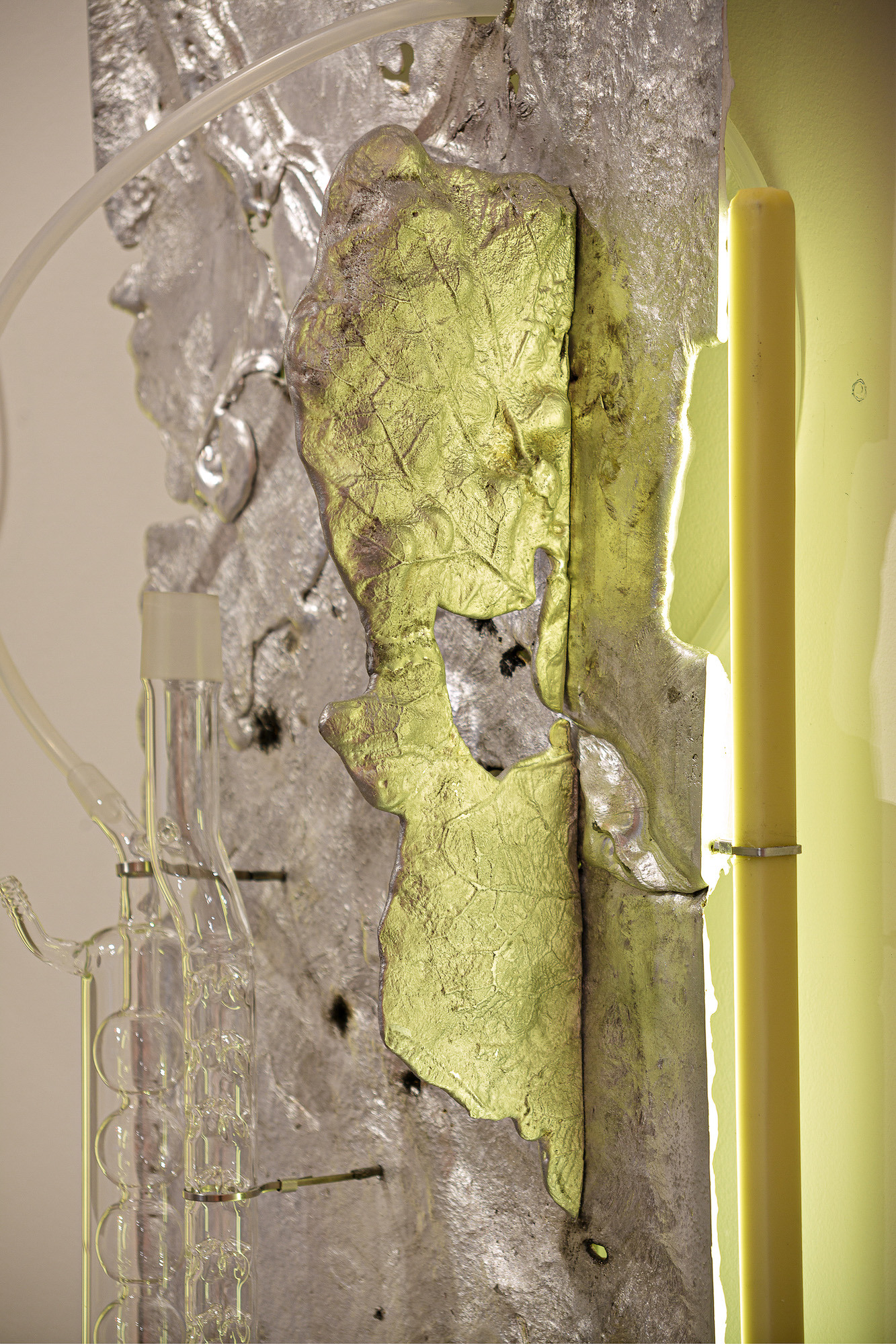 Pakui Hardware, Heat Treated, 2024. Casted aluminium, laboratory glass, bees wax, silicone rubber, stainless steel, LED light, 79,5x34,13 cm