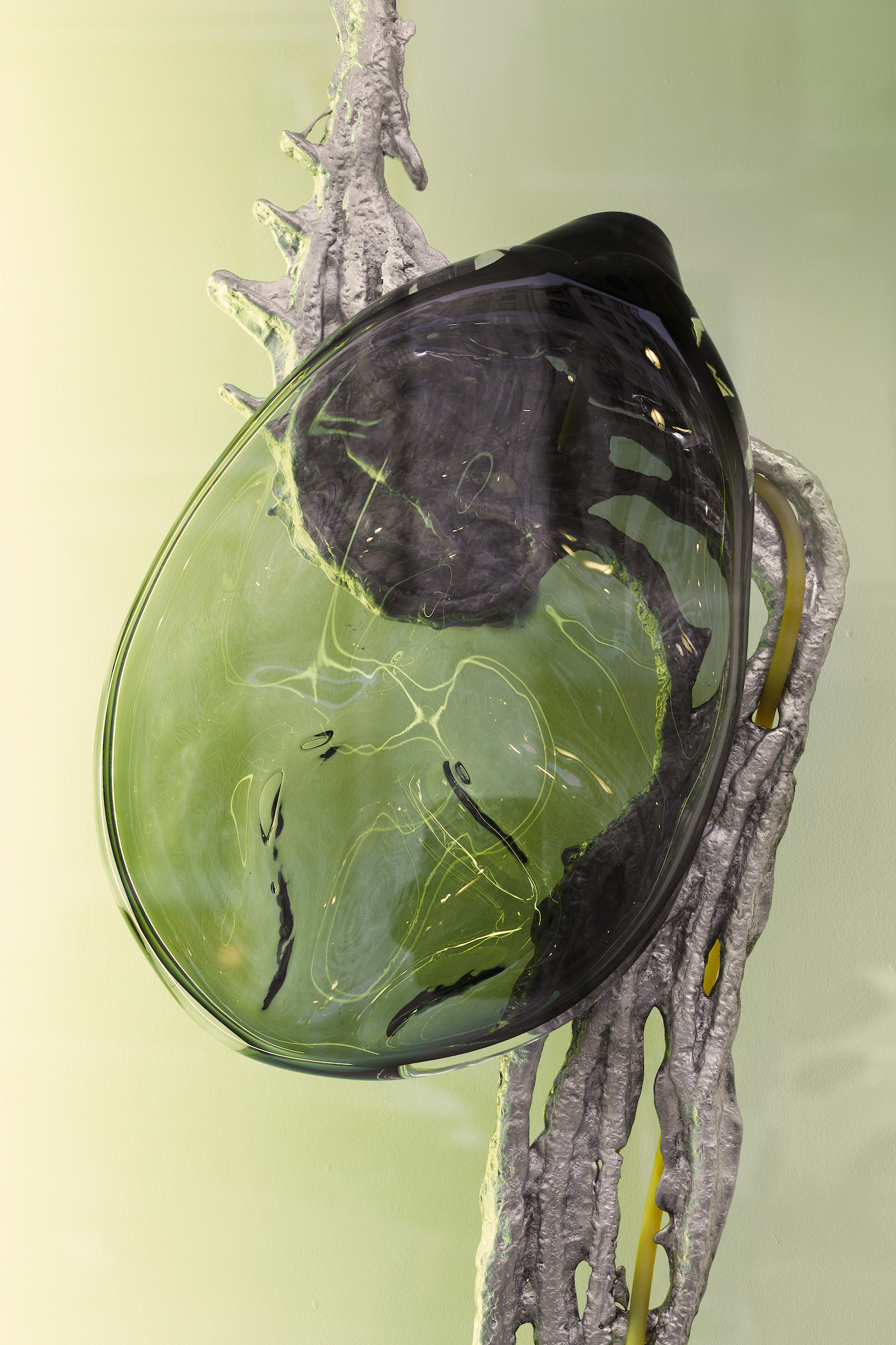 Pakui Hardware, Inflammation, 2024. Casted aluminium, glass,  rubber, bees wax, LED light, stainless steel, 175x43x18 cm