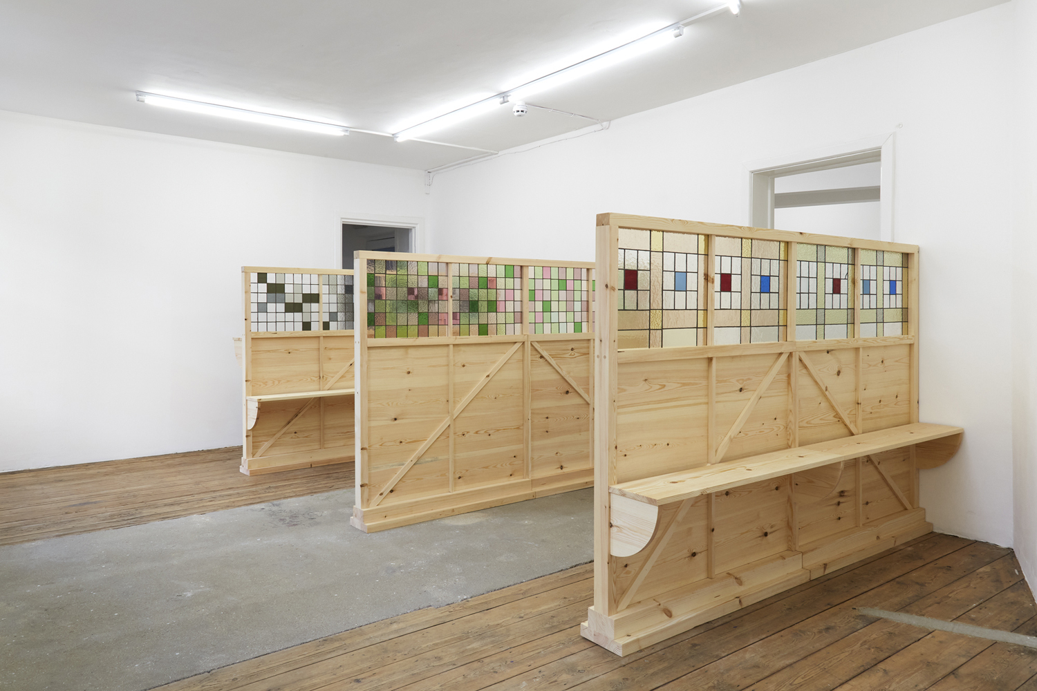 Georgina Hill, Bread and wine, 2024. Assorted redwood, stained glass and solder, Left to Right: i) 230 x 150 x 51 cm, ii) 230 x 150 x 21 cm, iii) 230 x 150 x 40 cm
