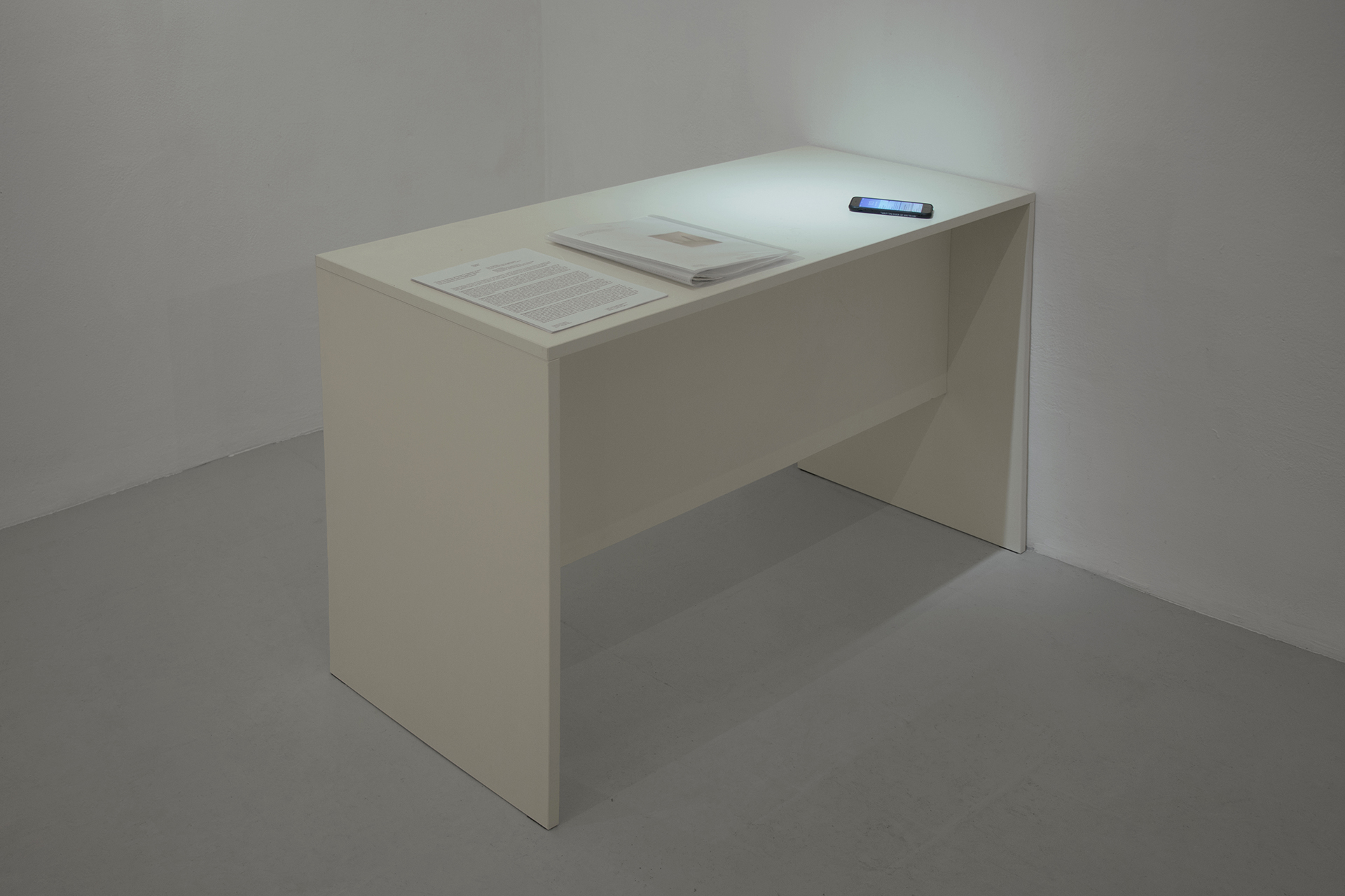 Andrea Magnani, SHUT THE FUCK UP AND WORK, 2024. Laminated wood, plastic, digital print on paper, uv print on mobile phone cover, mobile phone. 120 x 53 x 77 cm.