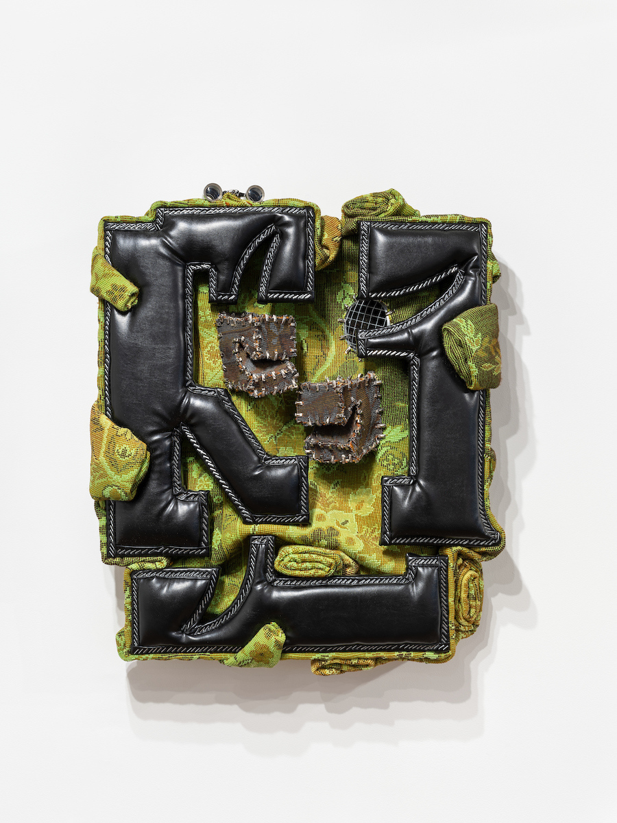 Cezary Poniatowski, Domesticated, 2024, Faux leather, upholstery foam, carpet, screws, metal zip ties, wood, binoculars, 70 × 60 × 15 cm. Courtesy of the artist and Crèvecœur, Paris. Photo: Martin Argyroglo