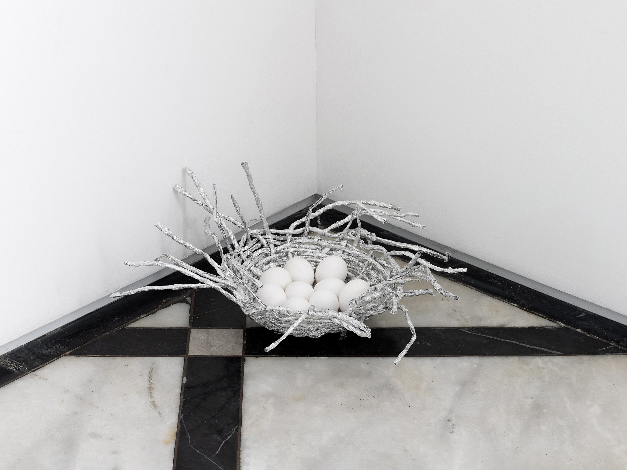 Untitled, 2024, aluminum foil and eggs, variable dimensions