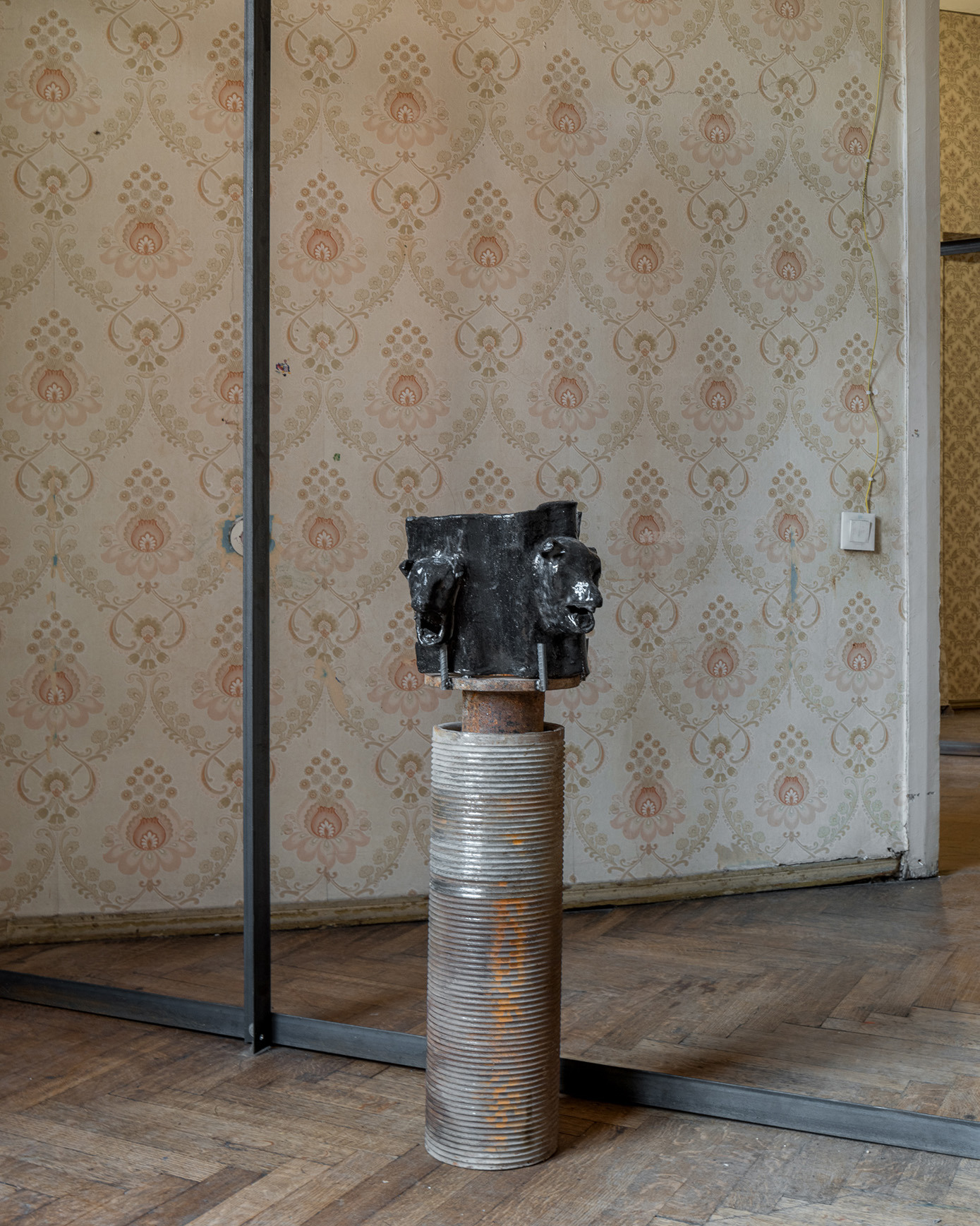 Qeu Meparishvili, Stories about stories, 2024, Chamote clay, Iron cylinder, 100 x 33 x 24 cm
