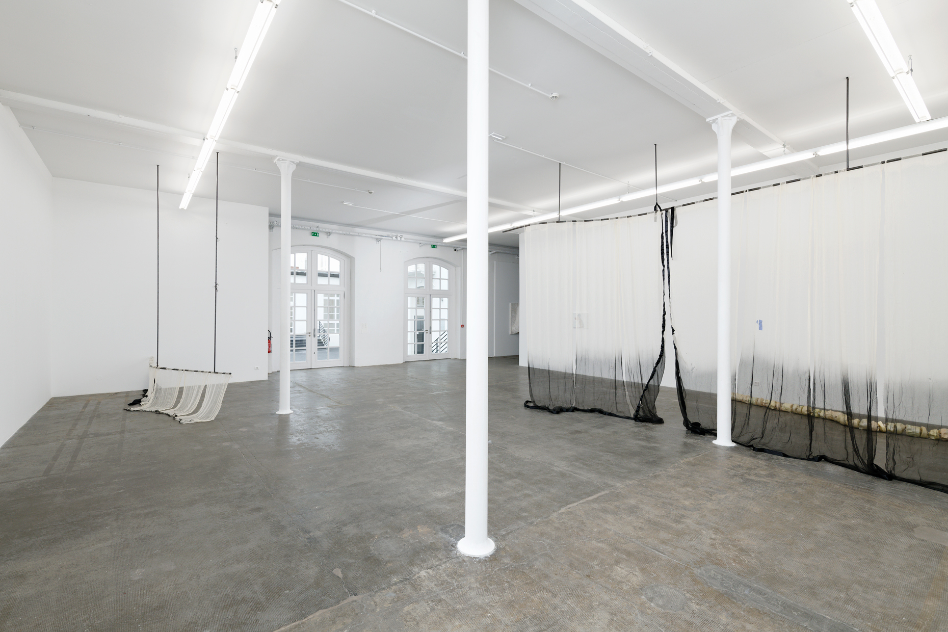 Leolie Greet, a curtain's hesitation. whether to hide or show (parts 1 & 2), 2023-2024. Steel, cotton, ink, satin, sewing thread. Courtesy of the artist.