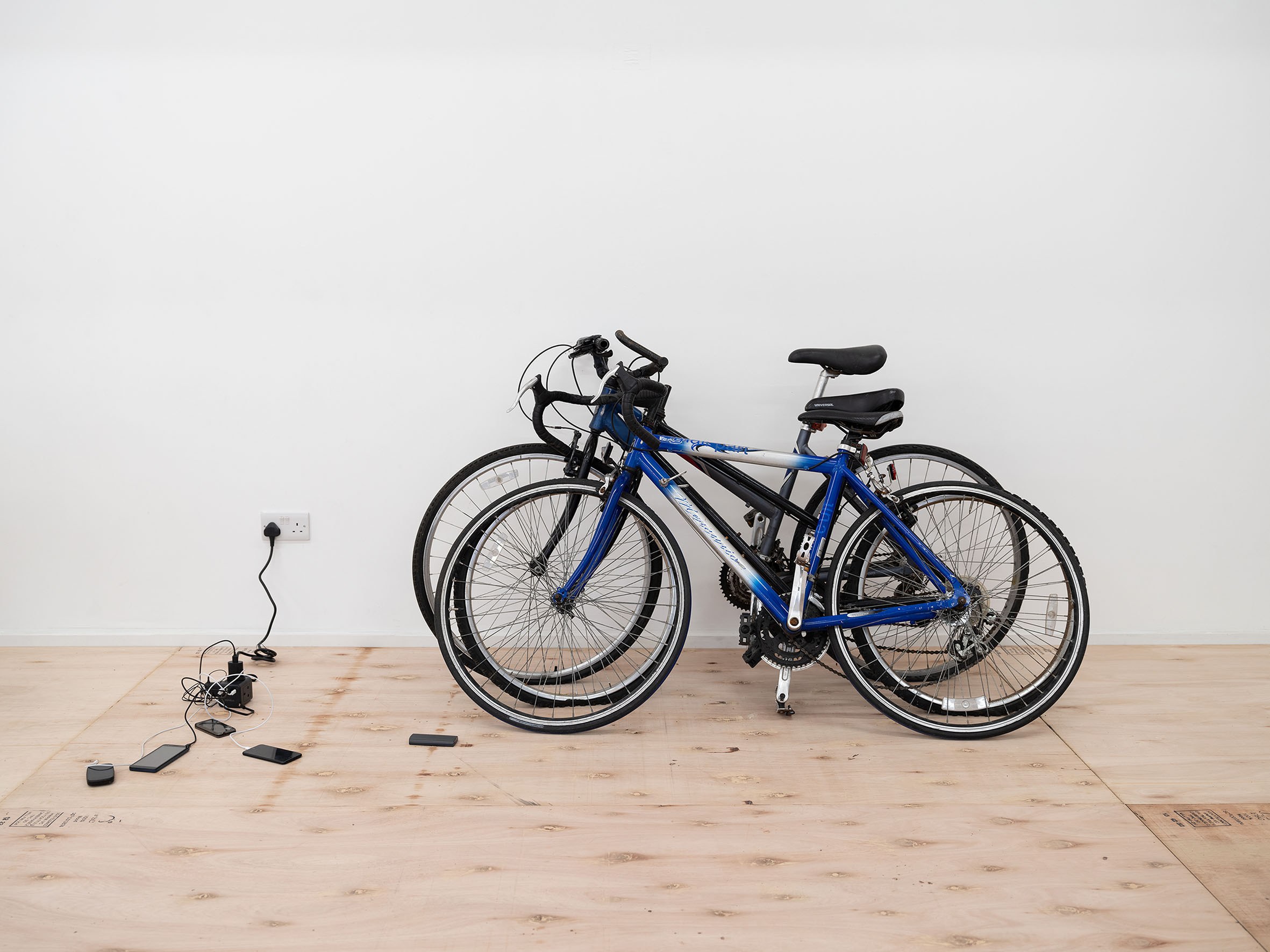Sam Cottington, Tallulah (Lora, stopover, small part cult), 2024, bikes, vinyl text, dimensions variable. Photo: Eleonora Agostini