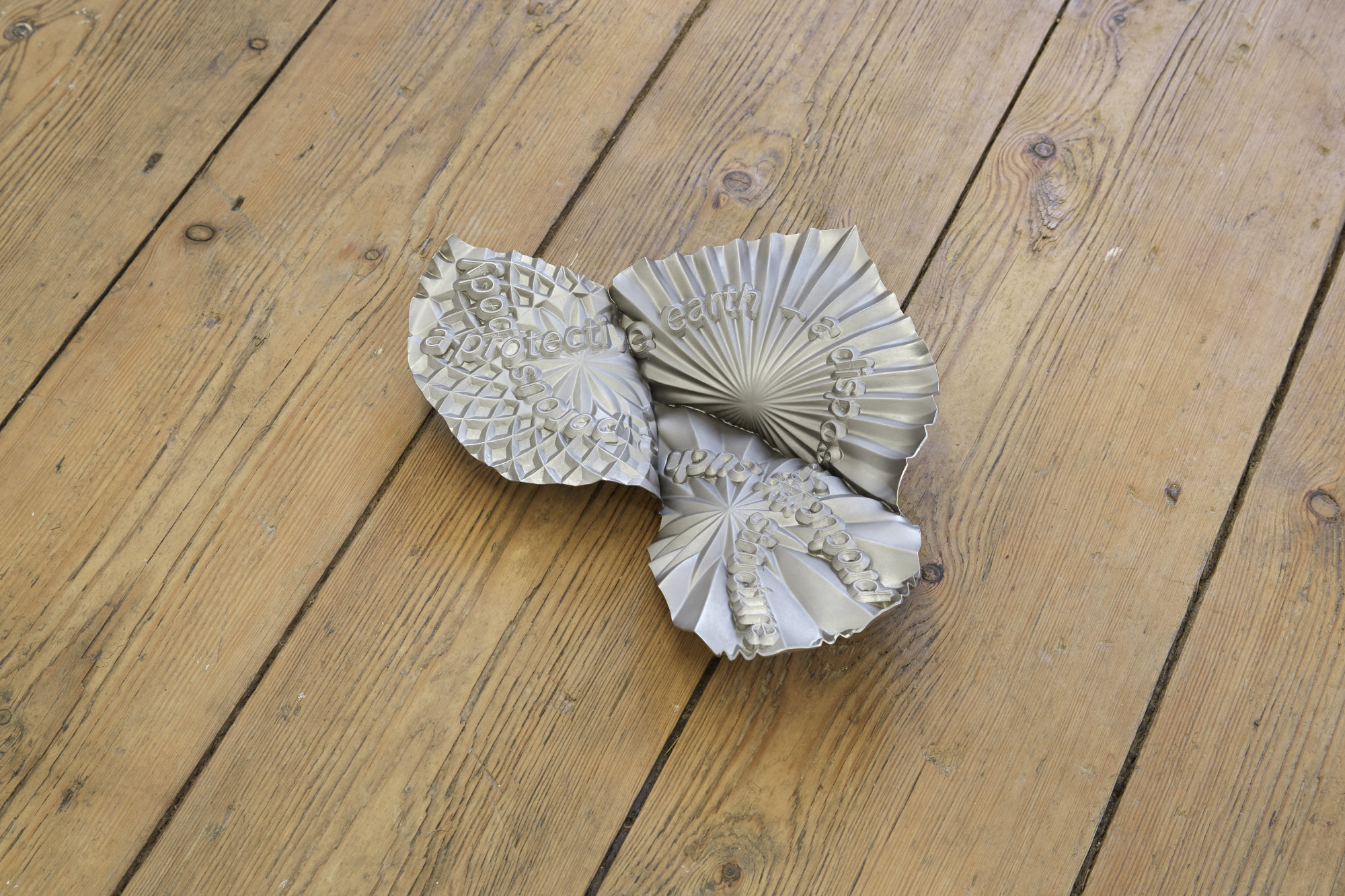 James Fuller, Slow scroller (a protective earth), 2024. Nickel plated copper, 28(L) x 20(W) x 5(D) cm