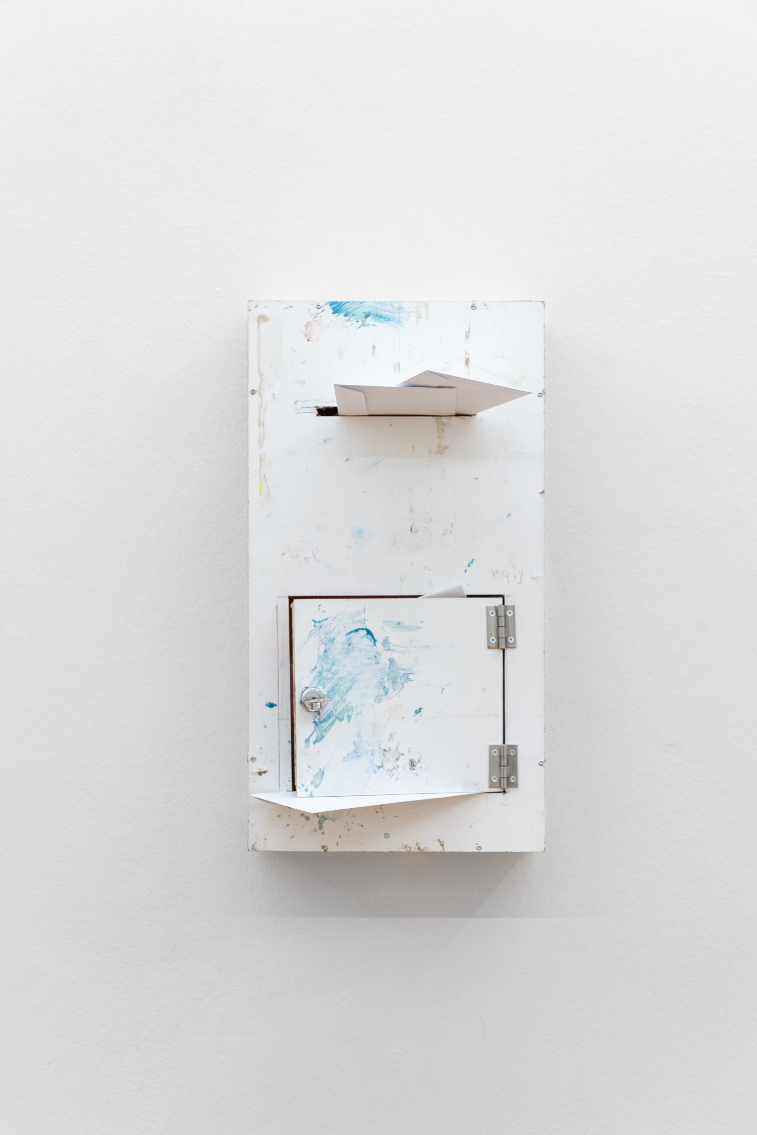 Patrick Ostrowsky, almsbox III (moved, address unknown), 2024, wood, plywood, paper, stainless steel, epoxy resin, key, 52 x 28 x 11 cm
