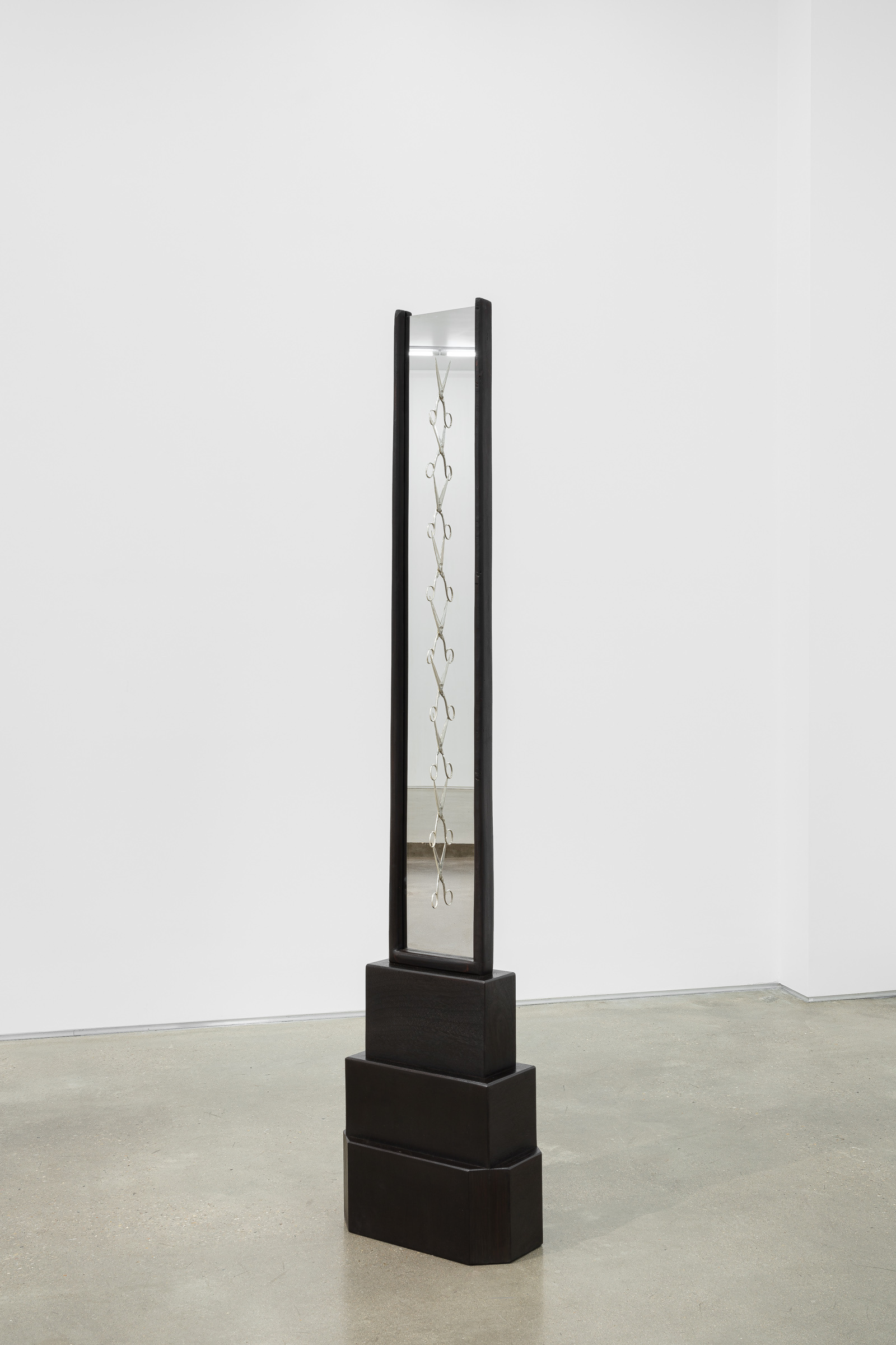 Mathilde Albouy, From mother to daughter to mother to daughter, 2024, Wood, wax, one-way mirror, silver and brass, 203 x 45 x 25 cm / 79 7/8 x 17 3/4 x 9 7/8 inches