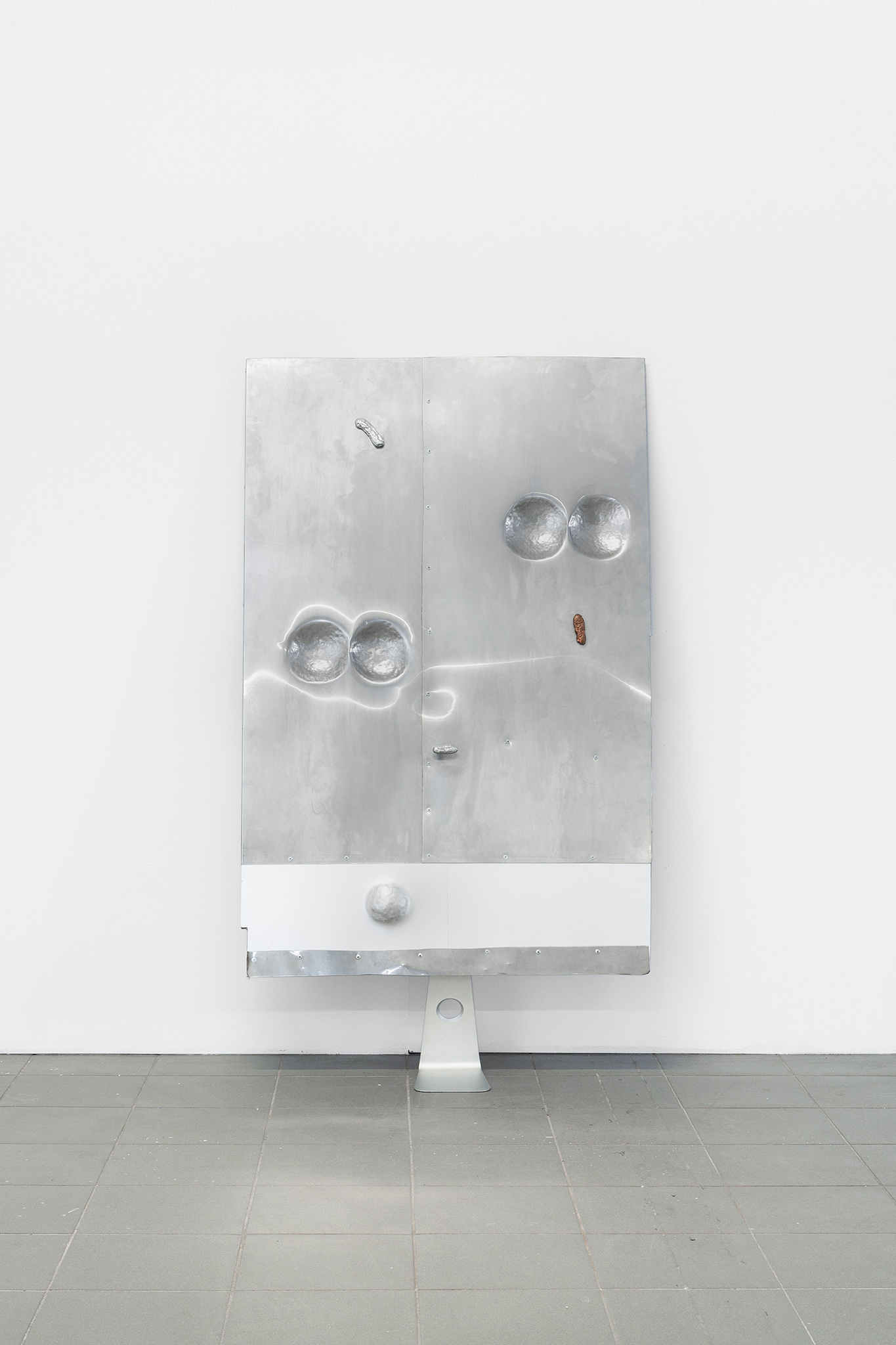 Matti Sumari, full time admin part time human, 2024, iMac foot, stainless steel from an illegal catering operation, plywood, aluminium, bronze, cast with metals found from dump sites