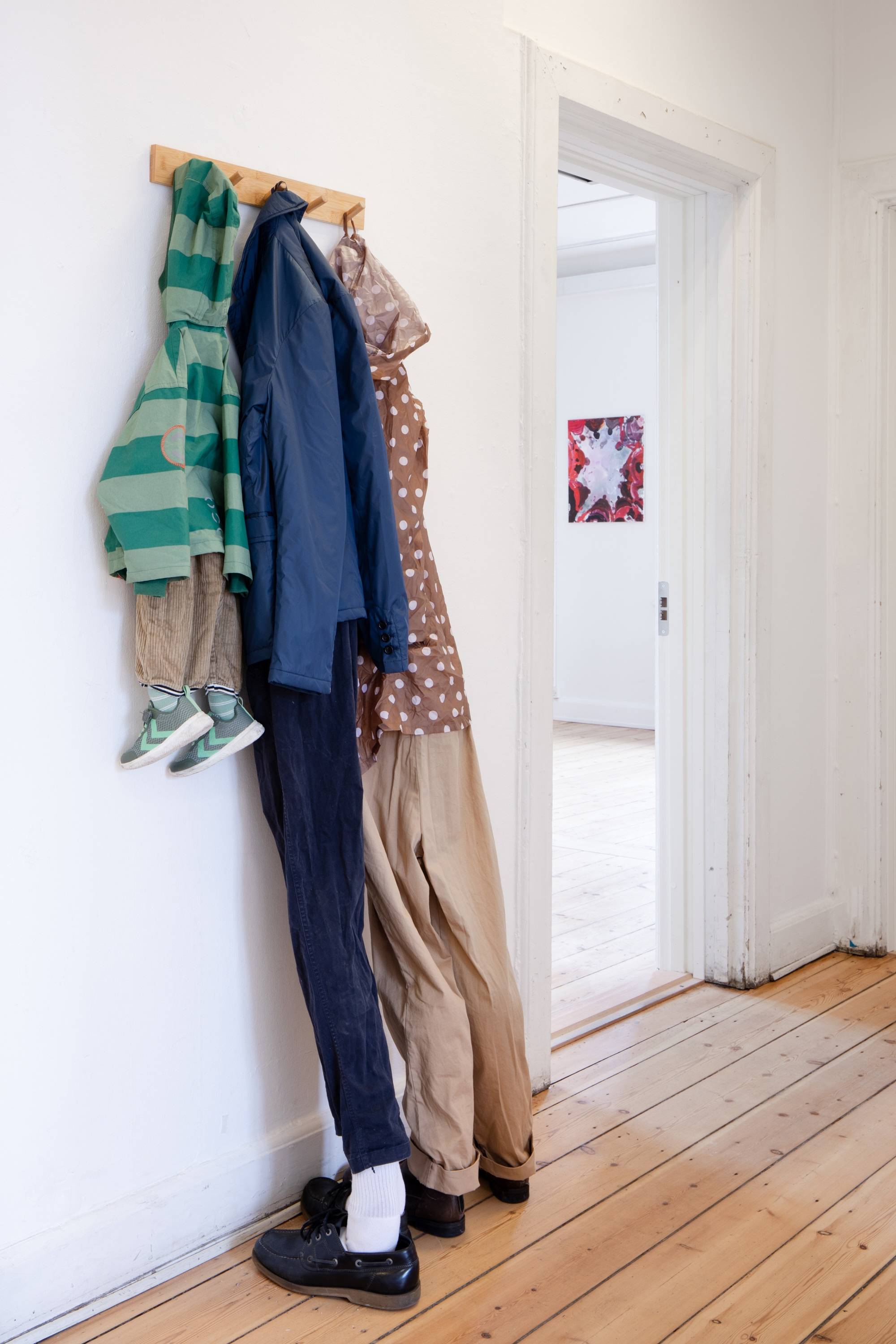 Rasmus Niclas Rose Nielsen, Simon Fensholm, âHomeâ, 2024, coat rack, clothes, shoes, glue, safety pins and toy stuffing, photo: Mads Holm