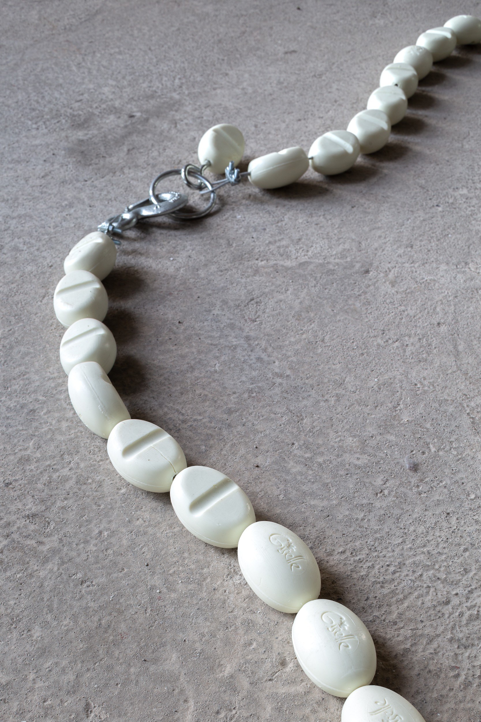 "Giselle" collaborative work by Dominique Bradbury and Agustina Jarpa. Soap bars and hooks, 2024