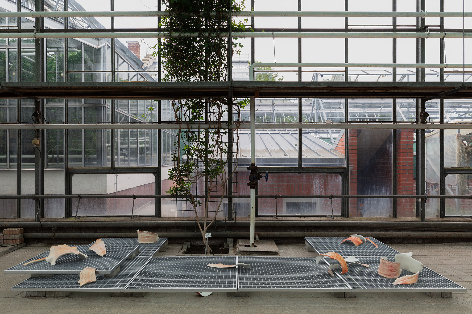 Erl, 2024, site-specific installation, porcelain clay, spray paint, grids, bricks, dimensions variable