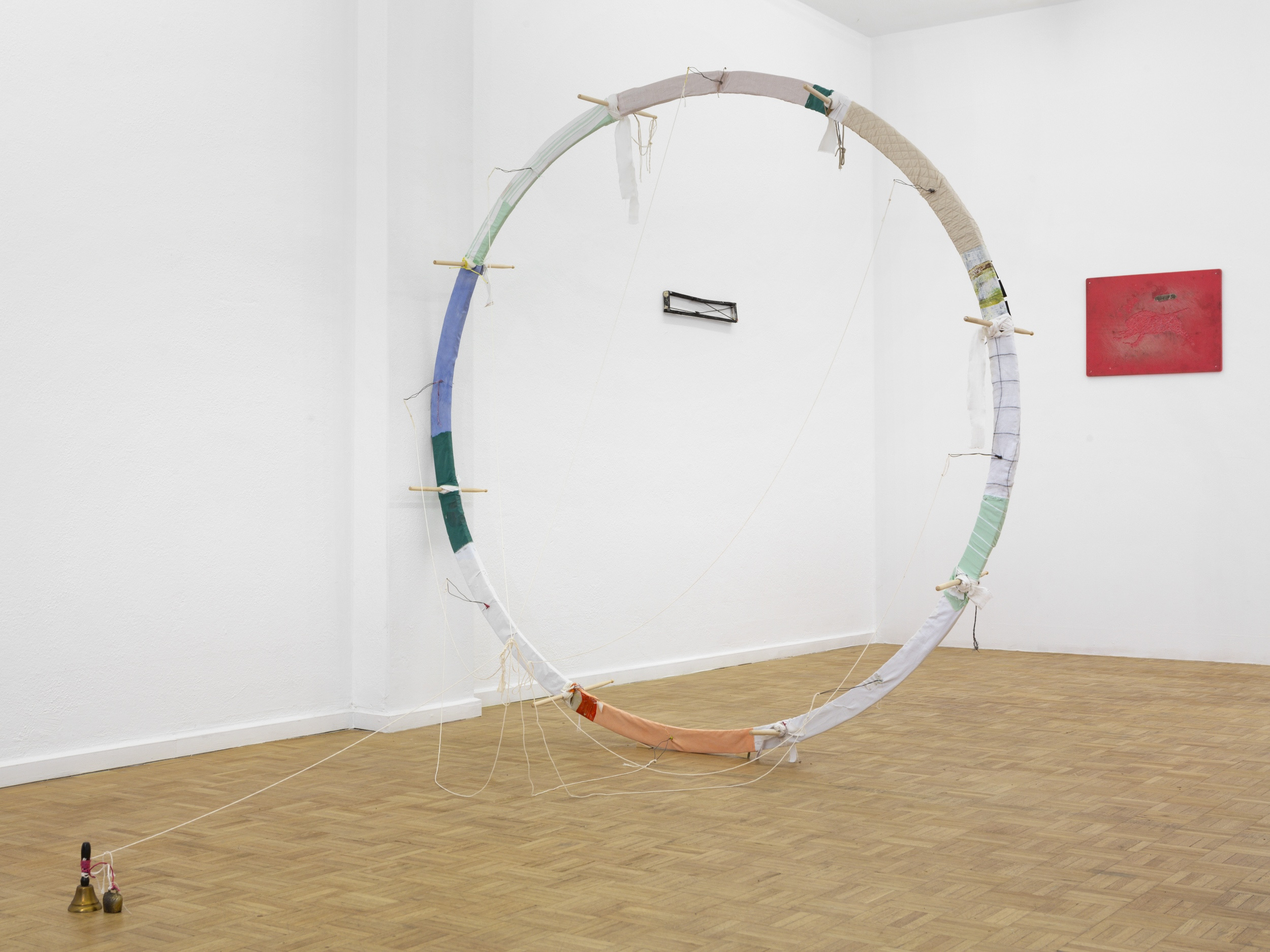 Manuel Schneider "Loom Large In The Mind, 2024," Wood, drum sticks, textiles, thread, wire, staples, bells, 220 x 220 cm
