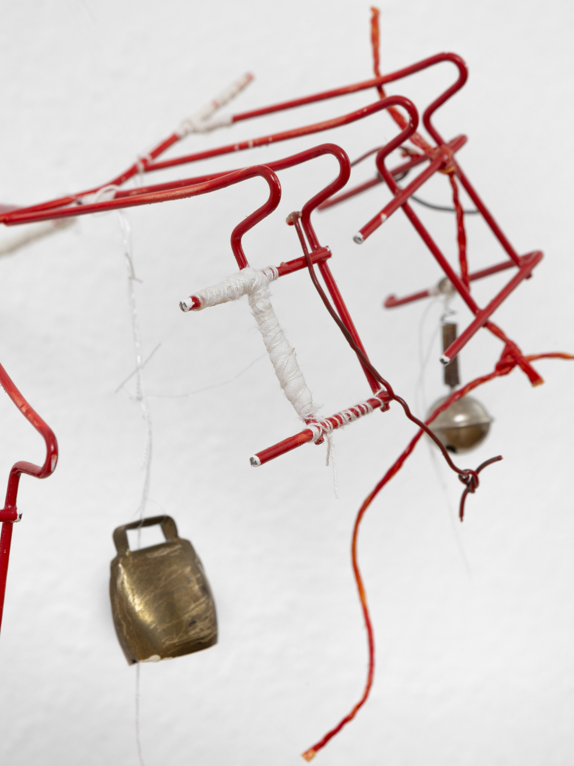 detail shot_Manuel Schneider, Sunken Ship Within The Eye, 2024, Plate dryer, spray paint, bells, thread, wire fishing line, 25 x 40 x 30 cm