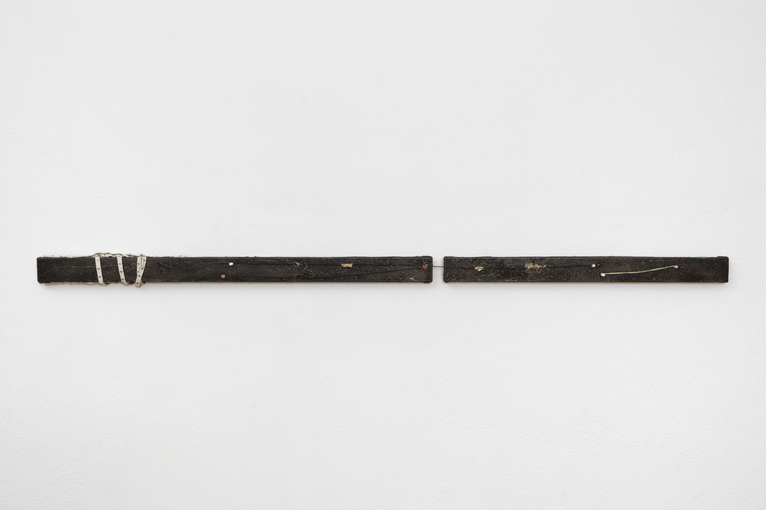 Clémence de La Tour du Pin "SPLIT, 2024," Oil paint, wax, pigment, umbrella rib, thumbtack, and ribbon on linen, 6 x 176 cm