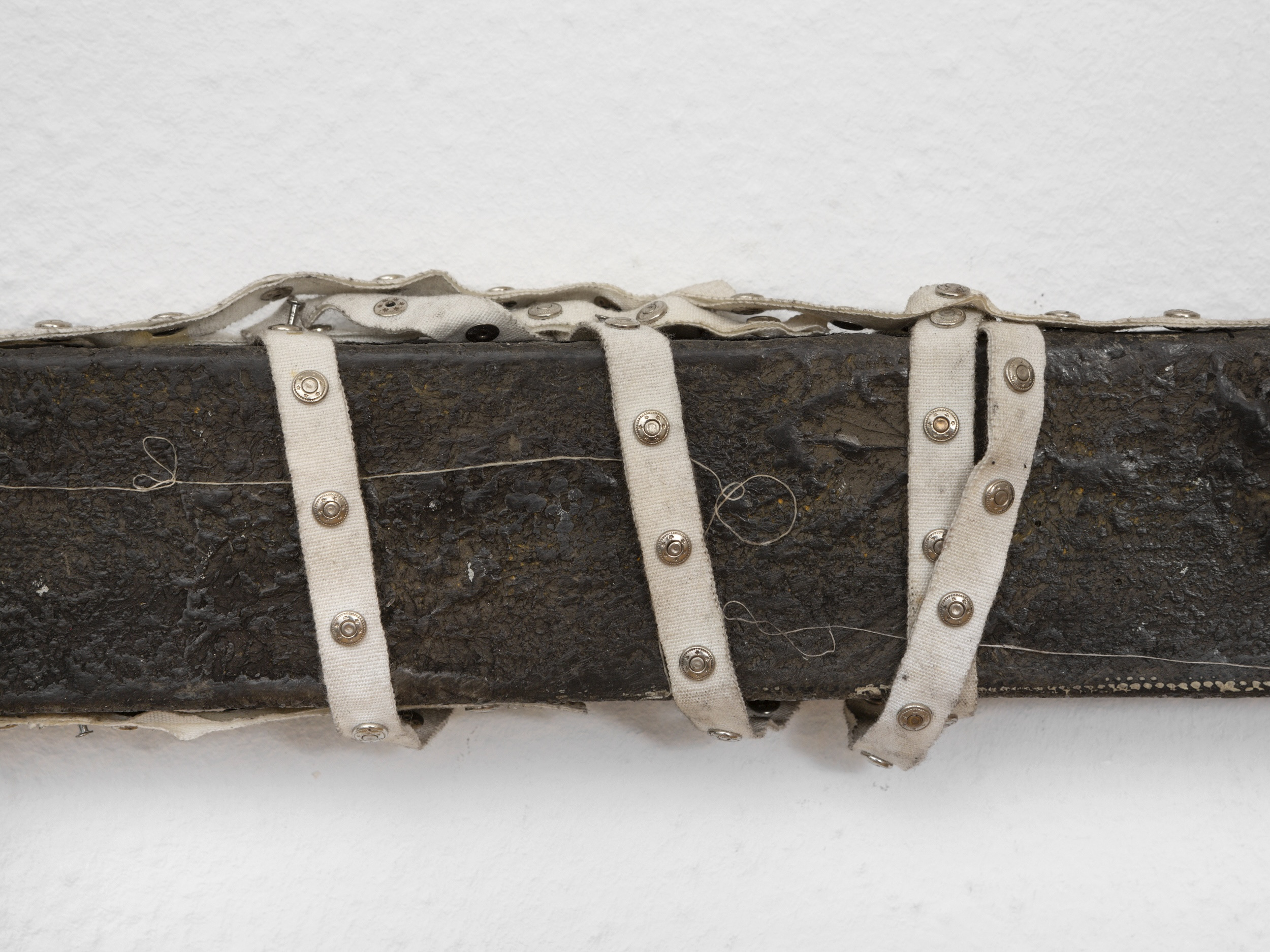 detail shot_Clémence de La Tour du Pin, SPLIT, 2024, Oil paint, wax, pigment, umbrella rib, thumbtack, and ribbon on linen, 6 x 176 cm