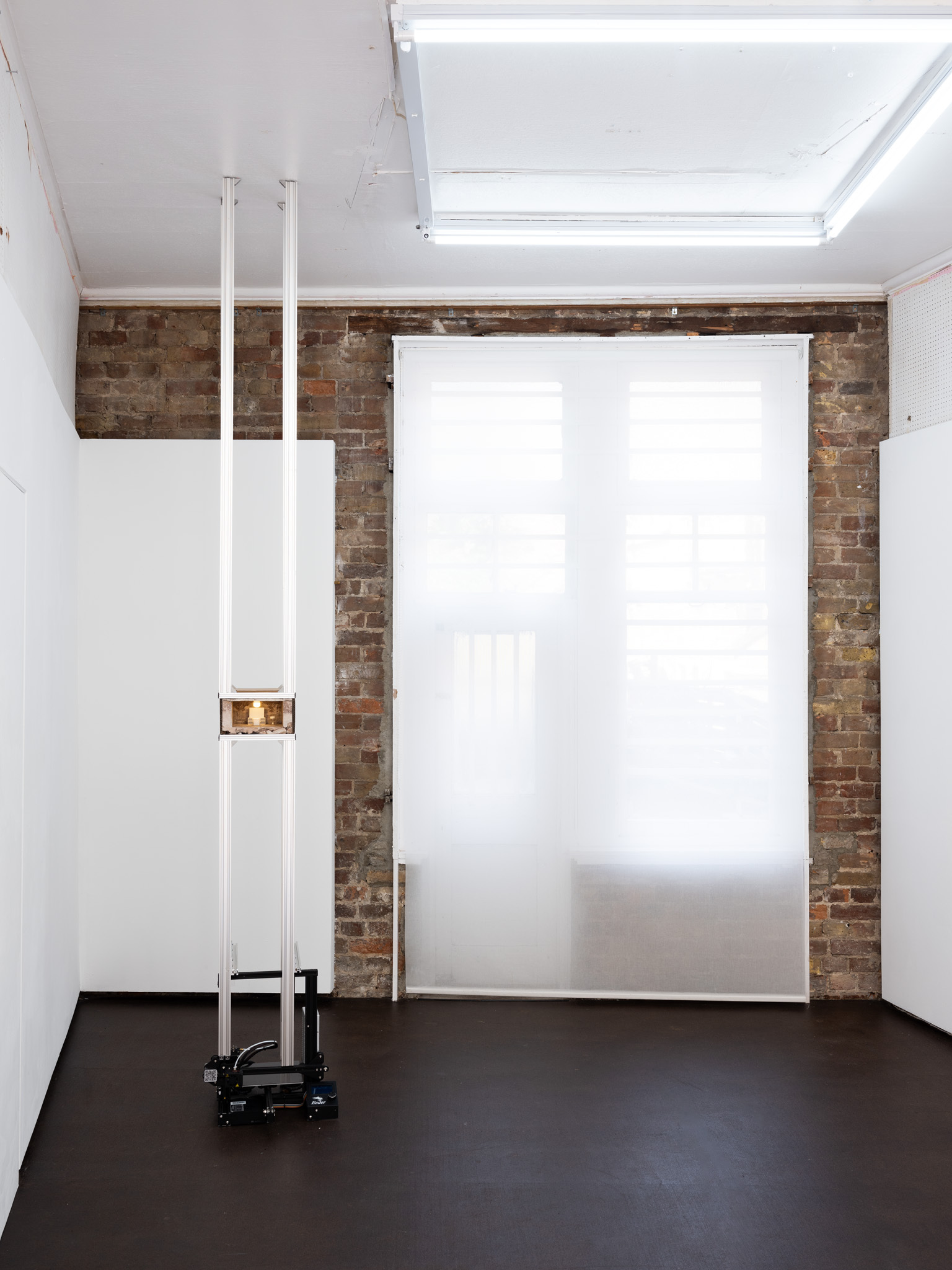 That’s the world I’m going to send you to!, 2024 3D printer, lime mortar, aluminium v slot, cardboard, 3D printed furniture, light 25 x 27 x 360cm (height variable)